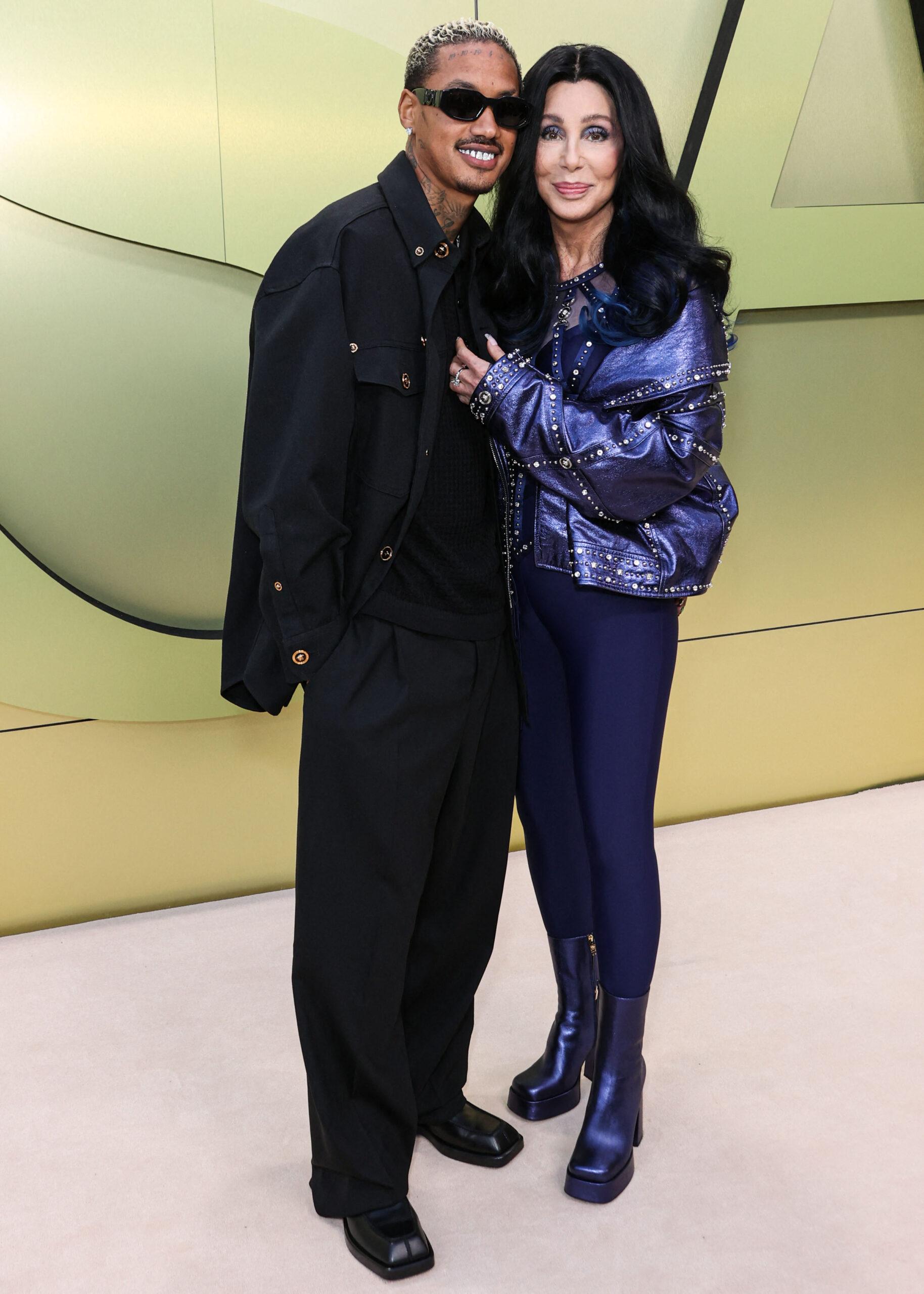 Alexander Edwards and girlfriend Cher arrive at the Versace Fall/Winter 2023 Fashion Show