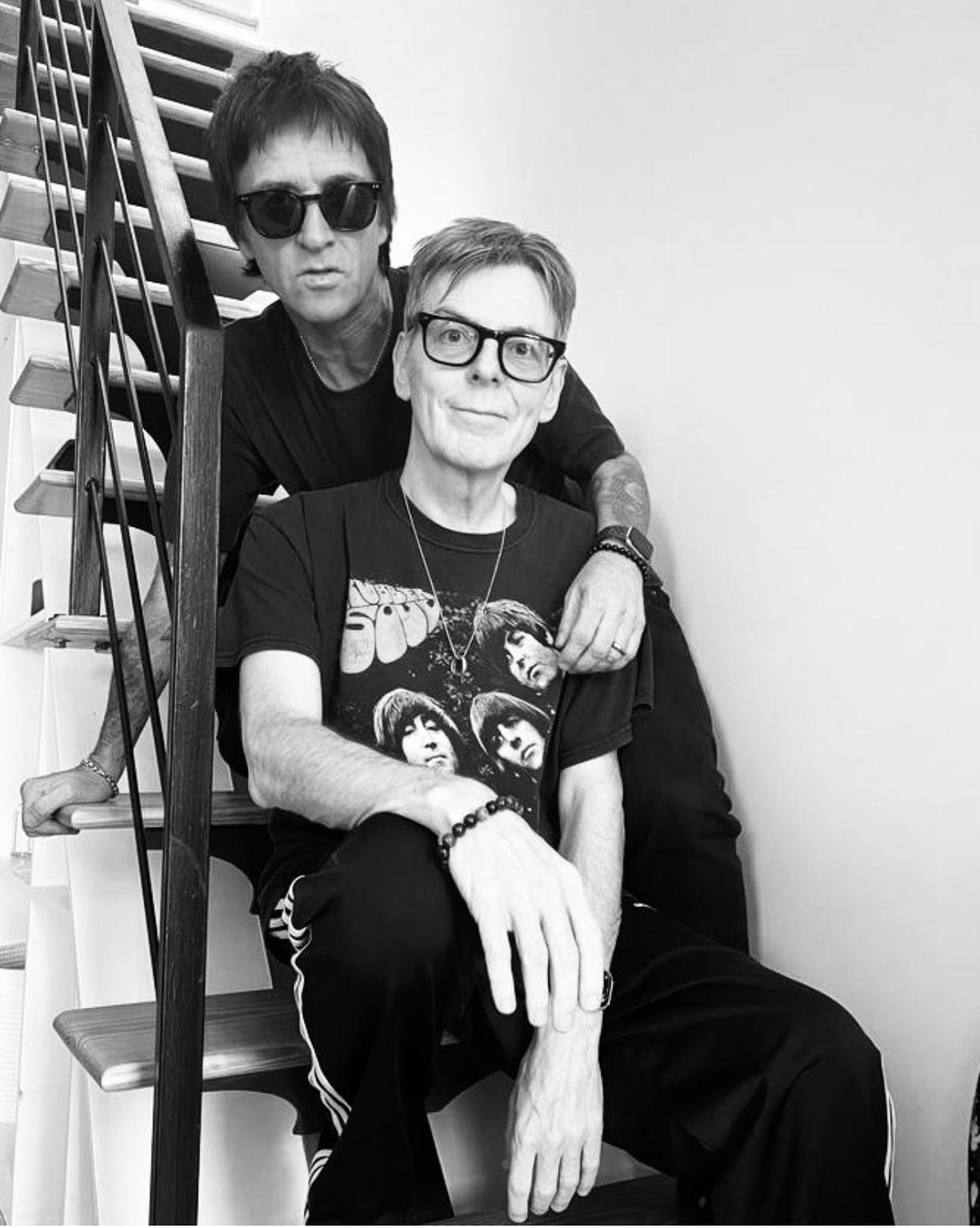 Black and white photo of Andy Rourke and Johnny Marr