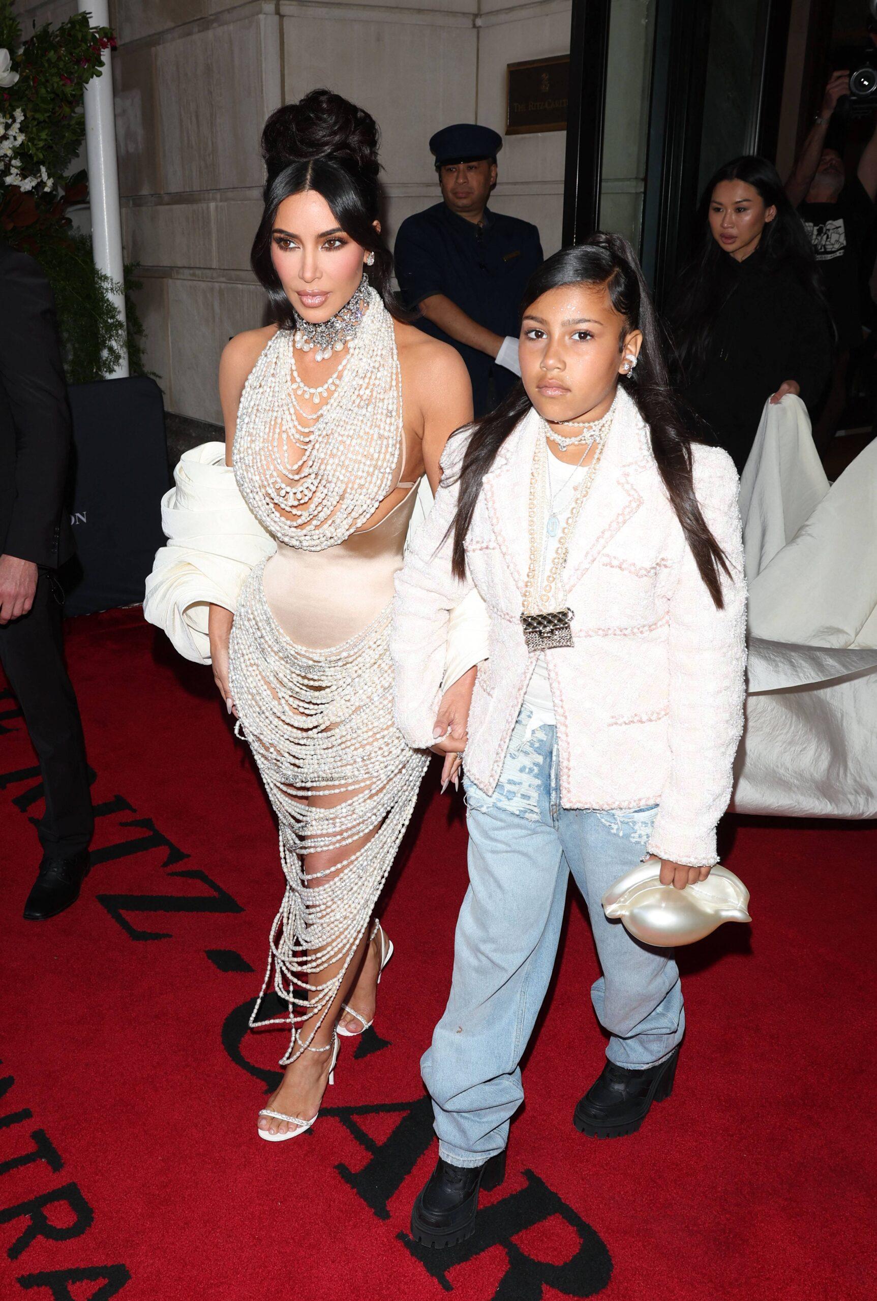 Kim Kardashian Stuns in Pearls with Daughter North West leaving the Ritz Hotel on there way to the Met Gala