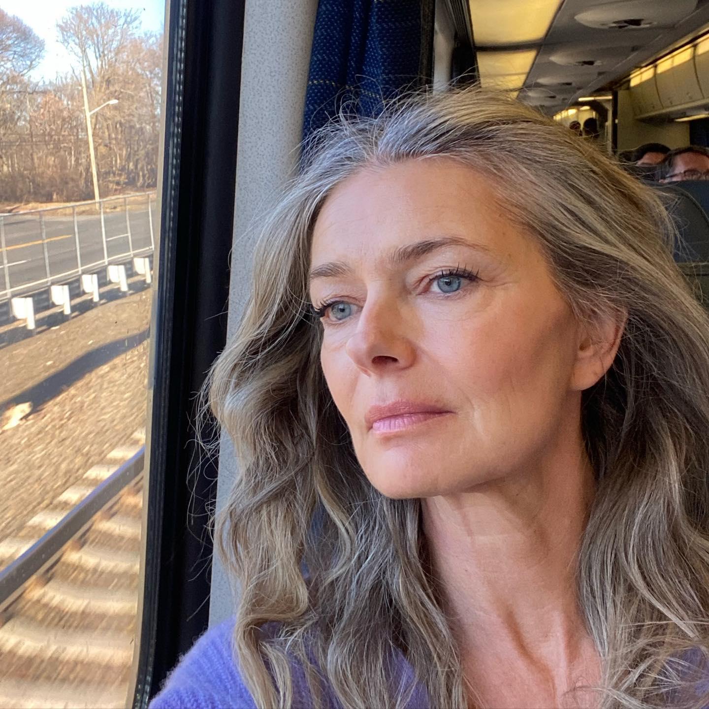 Paulina Porizkova looks sad on a train
