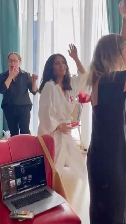 Salma Hayek has a wardrobe malfunction dancing in her bathrobe