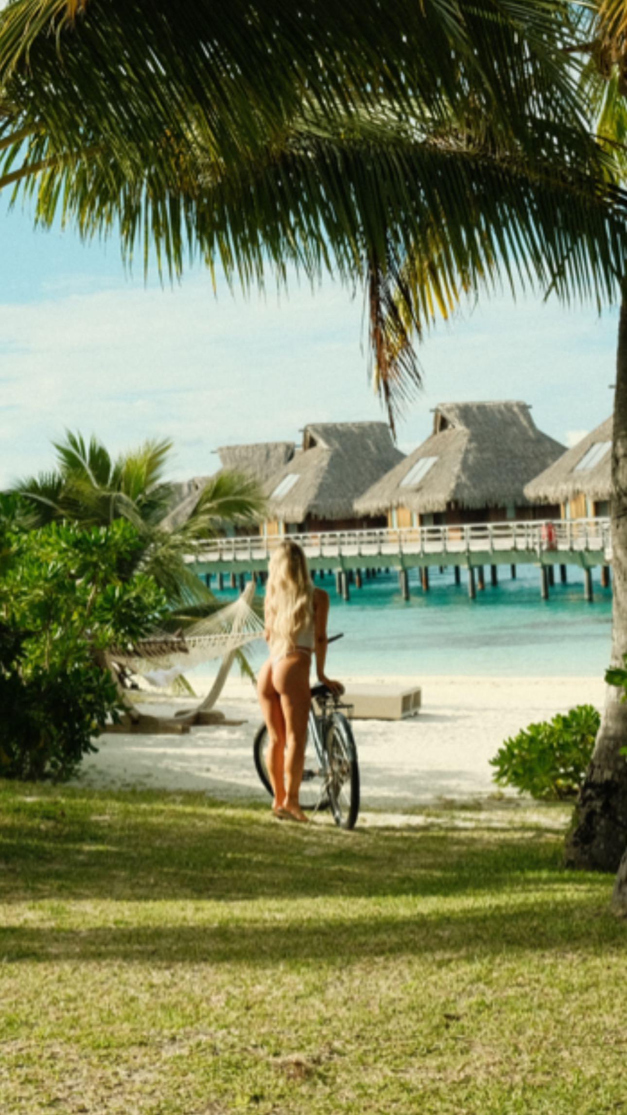 Emily Elizabeth going for a bike ride at the beach in Bora Bora.