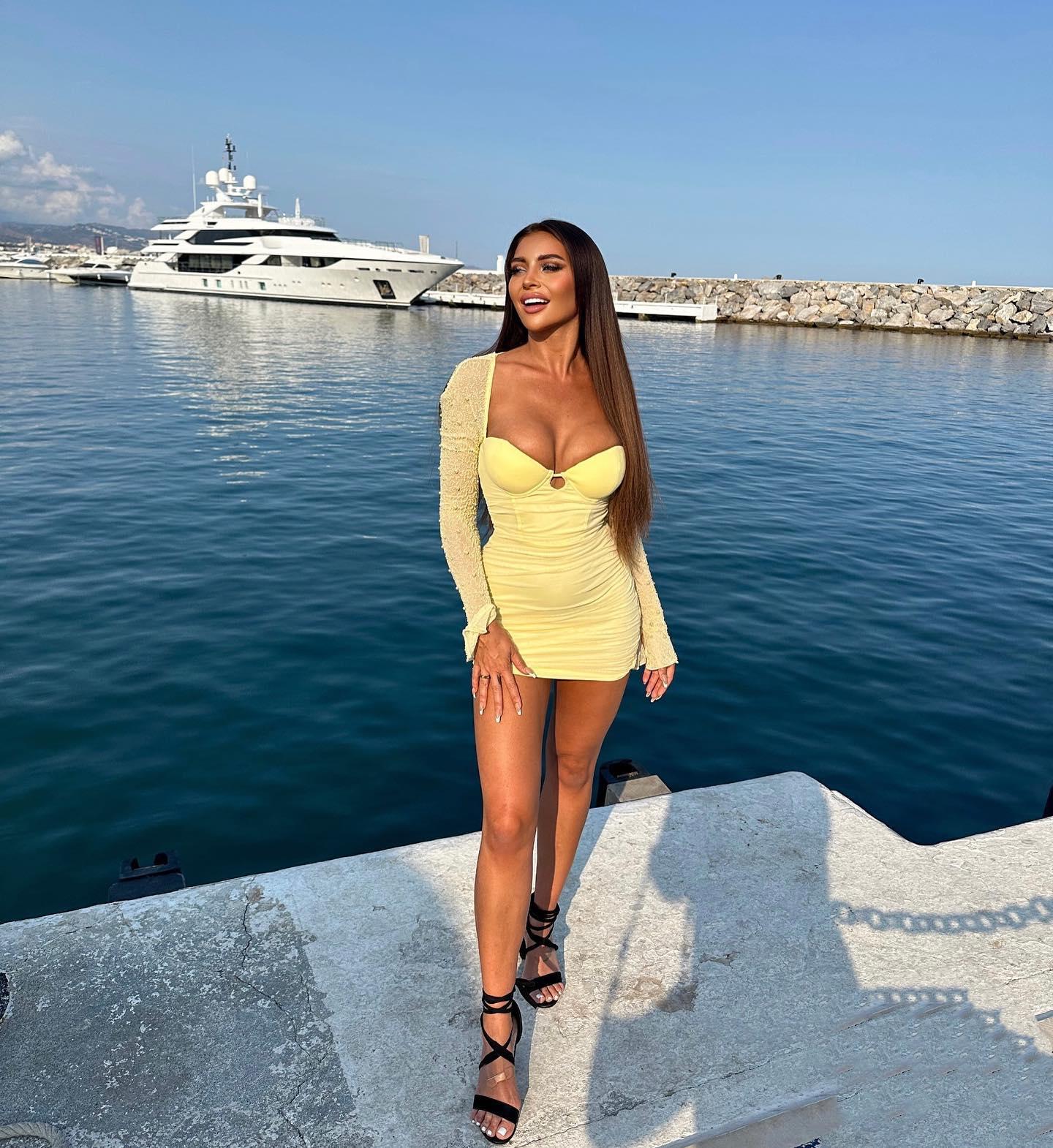 Larissa Trownson Is Practically Popping Out Of Her Little Yellow Dress