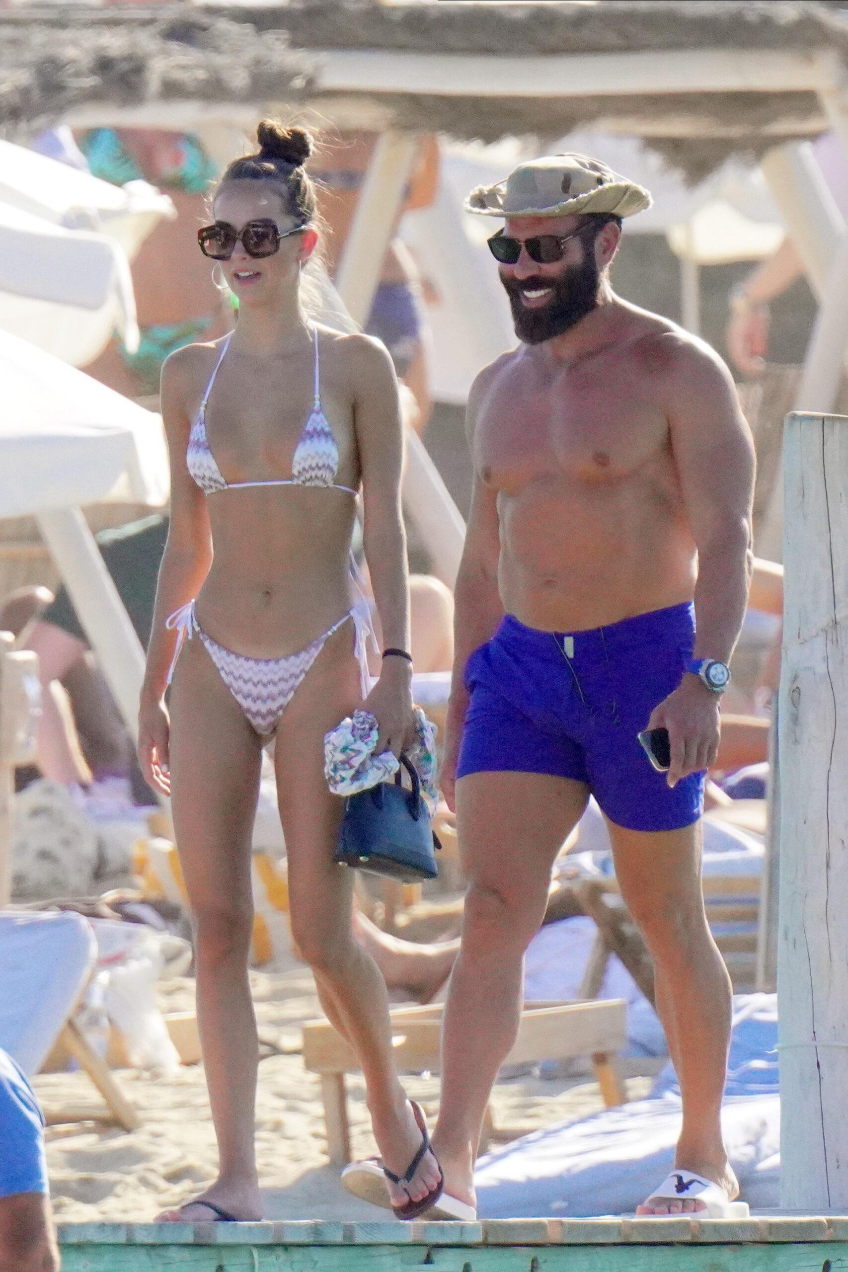 Dan Bilzerian and his girlfriend at Club 55 during holidays in St-Tropez