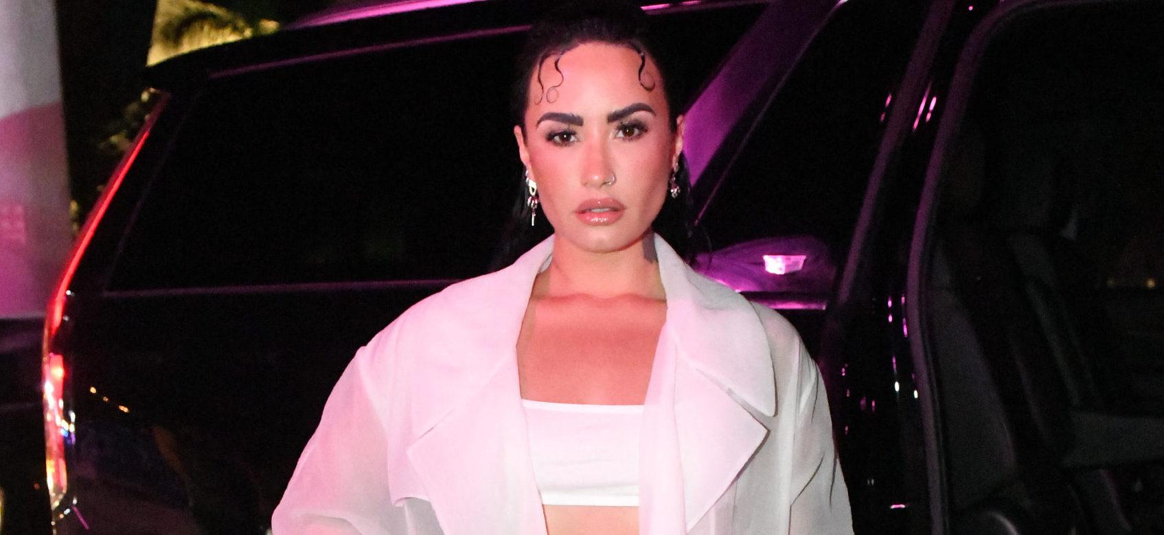 Demi Lovato arrives along with other celebrities to the Hugo Boss fashion show in Miami