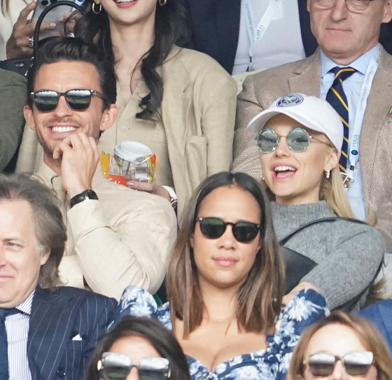 Jonathan Bailey and Ariana Grande watch Carlos Alcaraz vs Novak Djokovic in the Wimbledon 2023 men's final on Centre Court during day fourteen of the Wimbledon Tennis Championships at the All England Lawn Tennis and Croquet Club