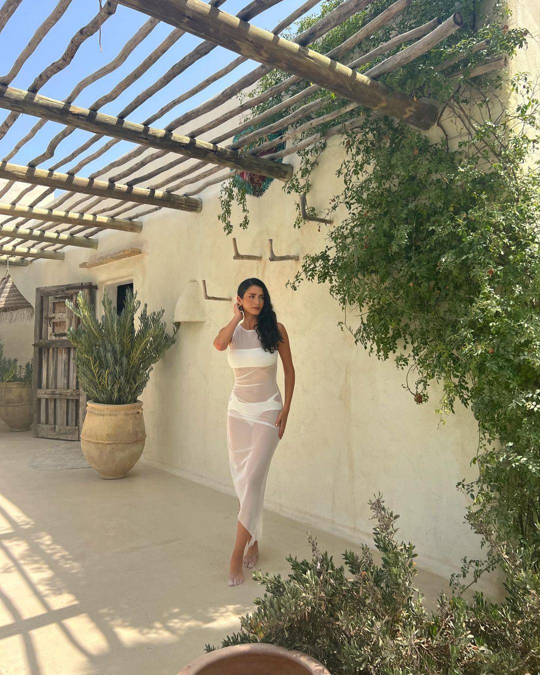 Ariel Frenkel Wears Mesh White Dress While Vacationing In Spain