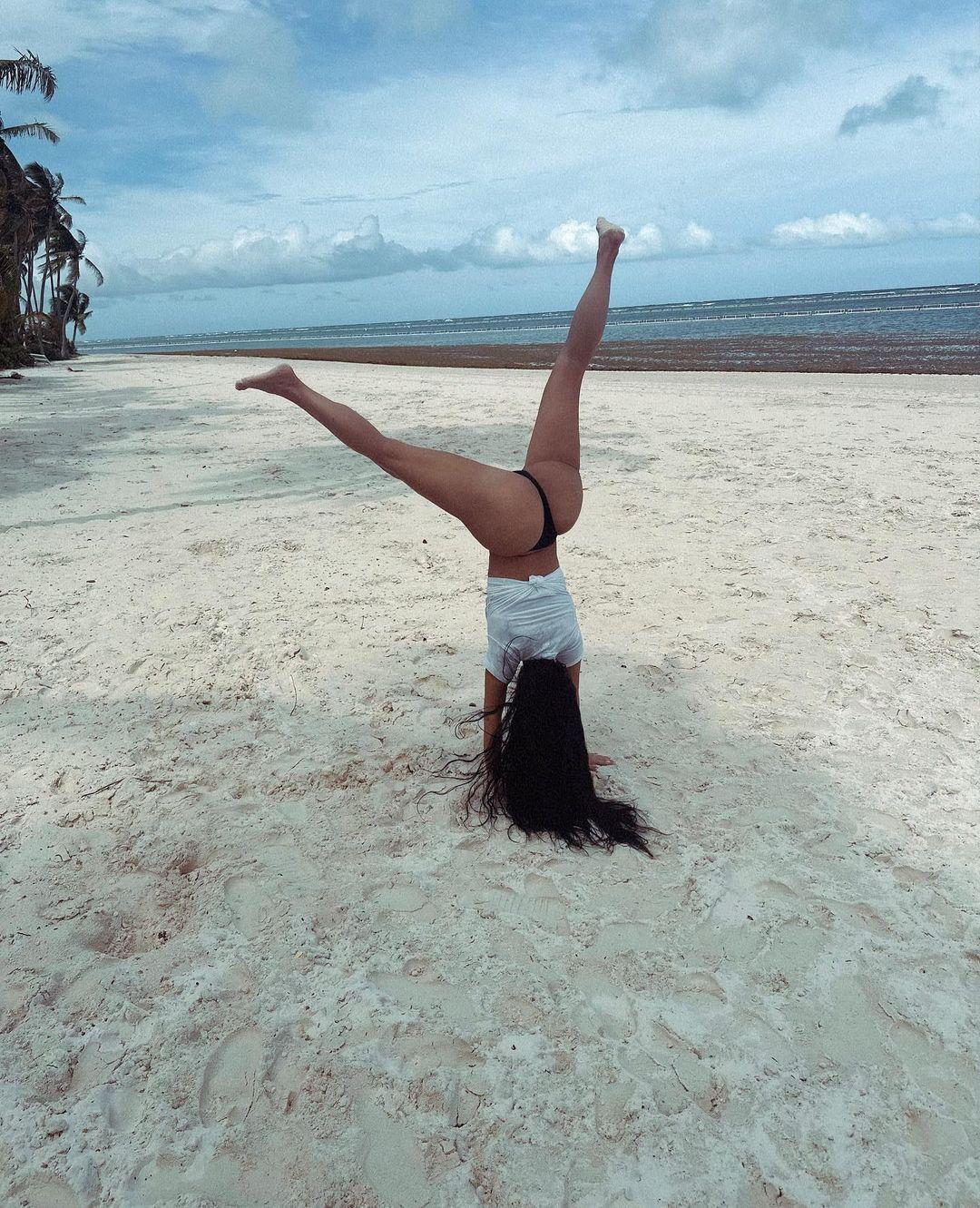 Kim Kardashian Does A Cartwheel In A Thong On The Beach