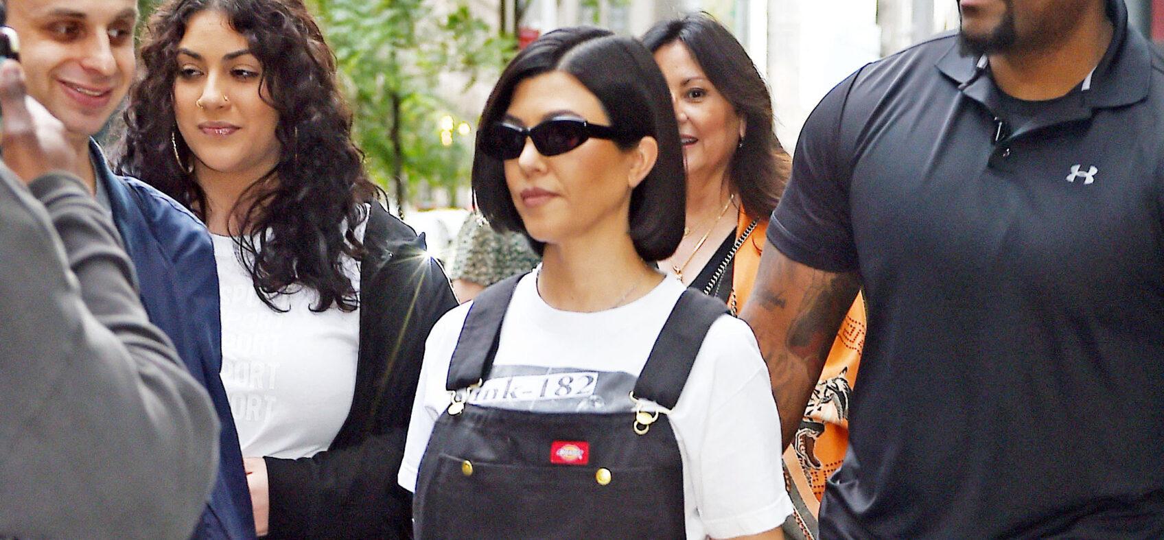 Kourtney Kardashian heads out in a Blink-182 t-shirt and overalls