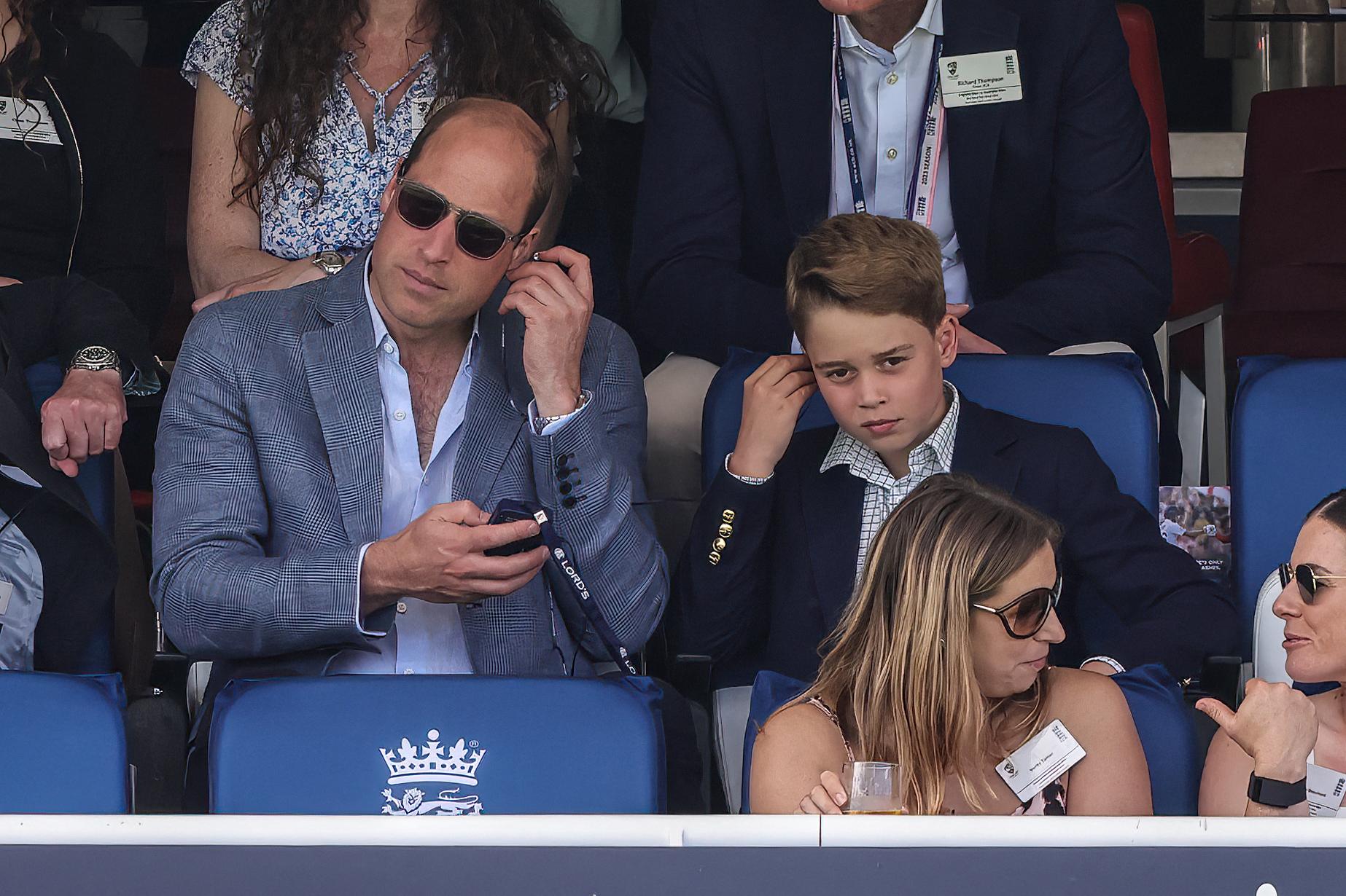 Prince William, Prince of Wales and Prince George of Wales celebrate the wicket of Pat Cummings of Australia during the LV= Insurance Ashes Test Series Second Test Day 4 England v Australia at Lords, London, United Kingdom,