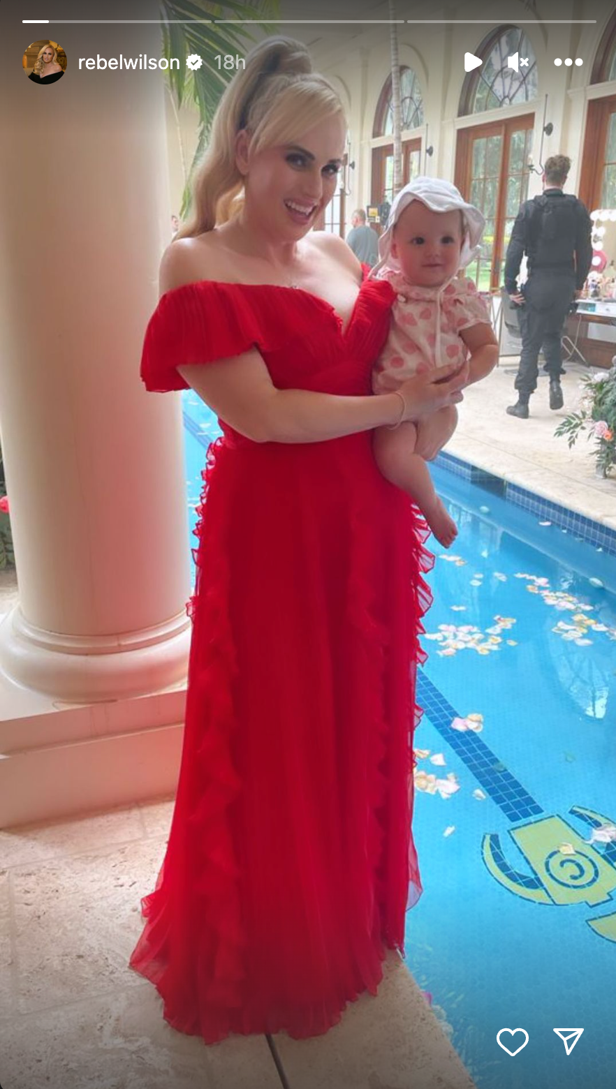 Rebel Wilson stuns in red as she carried daughter Royce