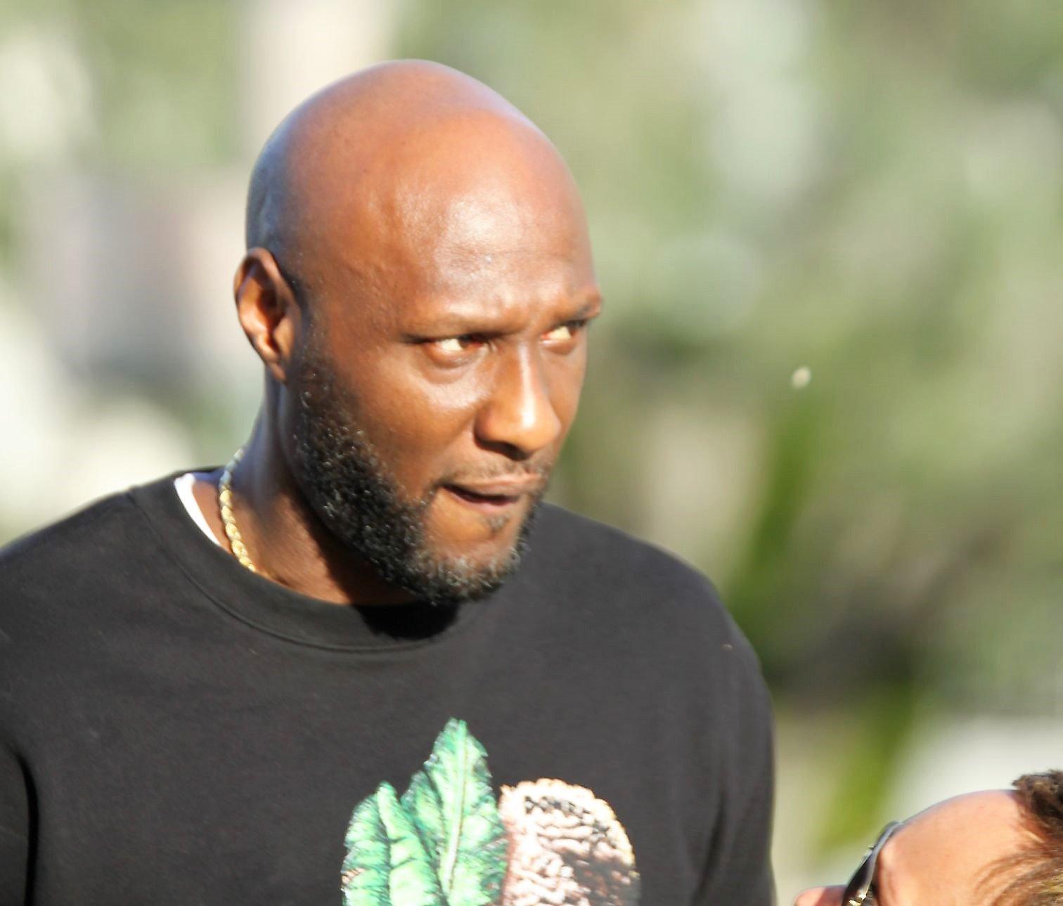 Lamar Odom and Sabrina Parr Appear To Have An Emotional Moment Before Leaving In Car