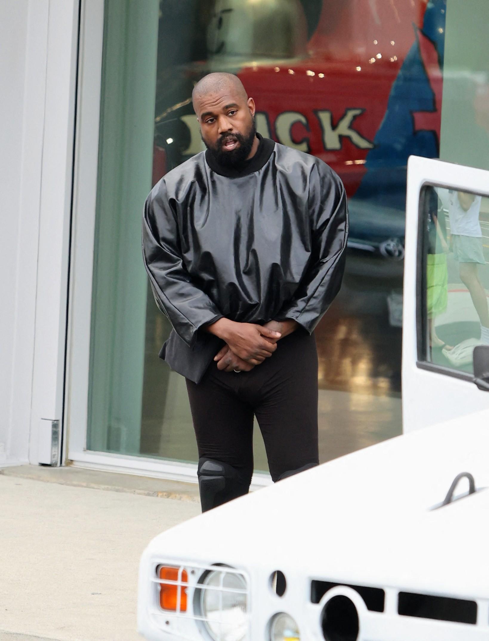 Kanye West seen in good spirits while shopping SUPREME and showing off his hummer with wife Bianca and friend