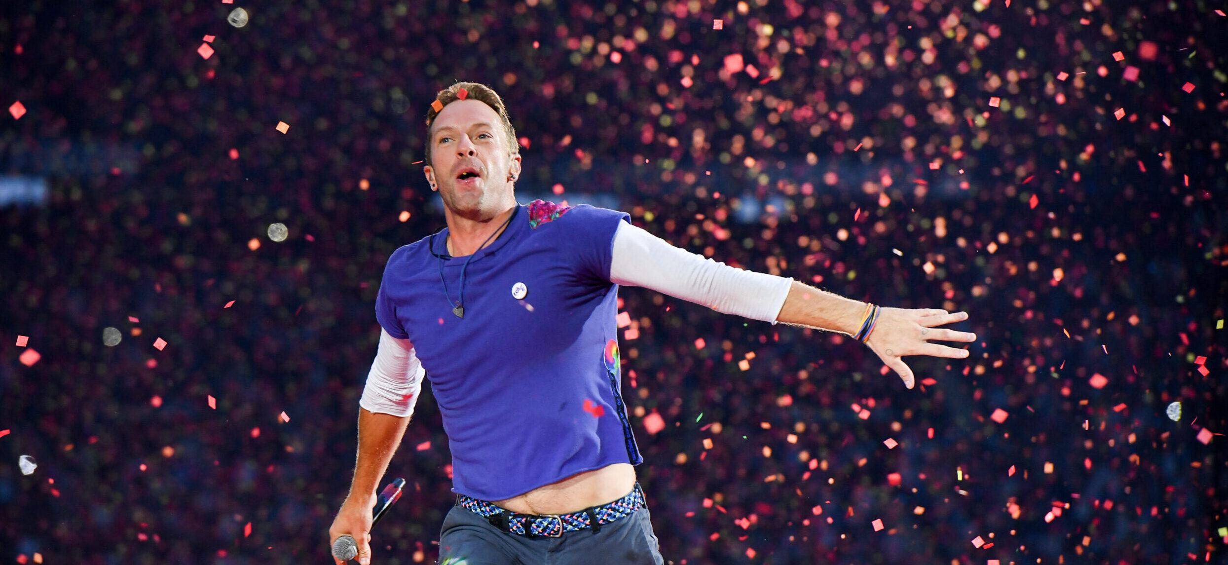 Chris Martin from Coldplay performs at Stade de France