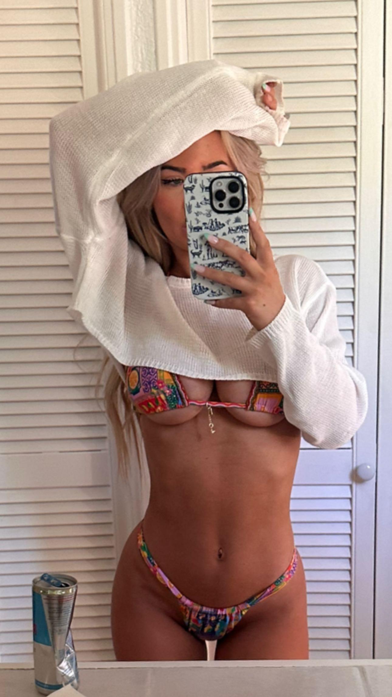 Emily Elizabeth snaps a selfie to show off her printed bikini.