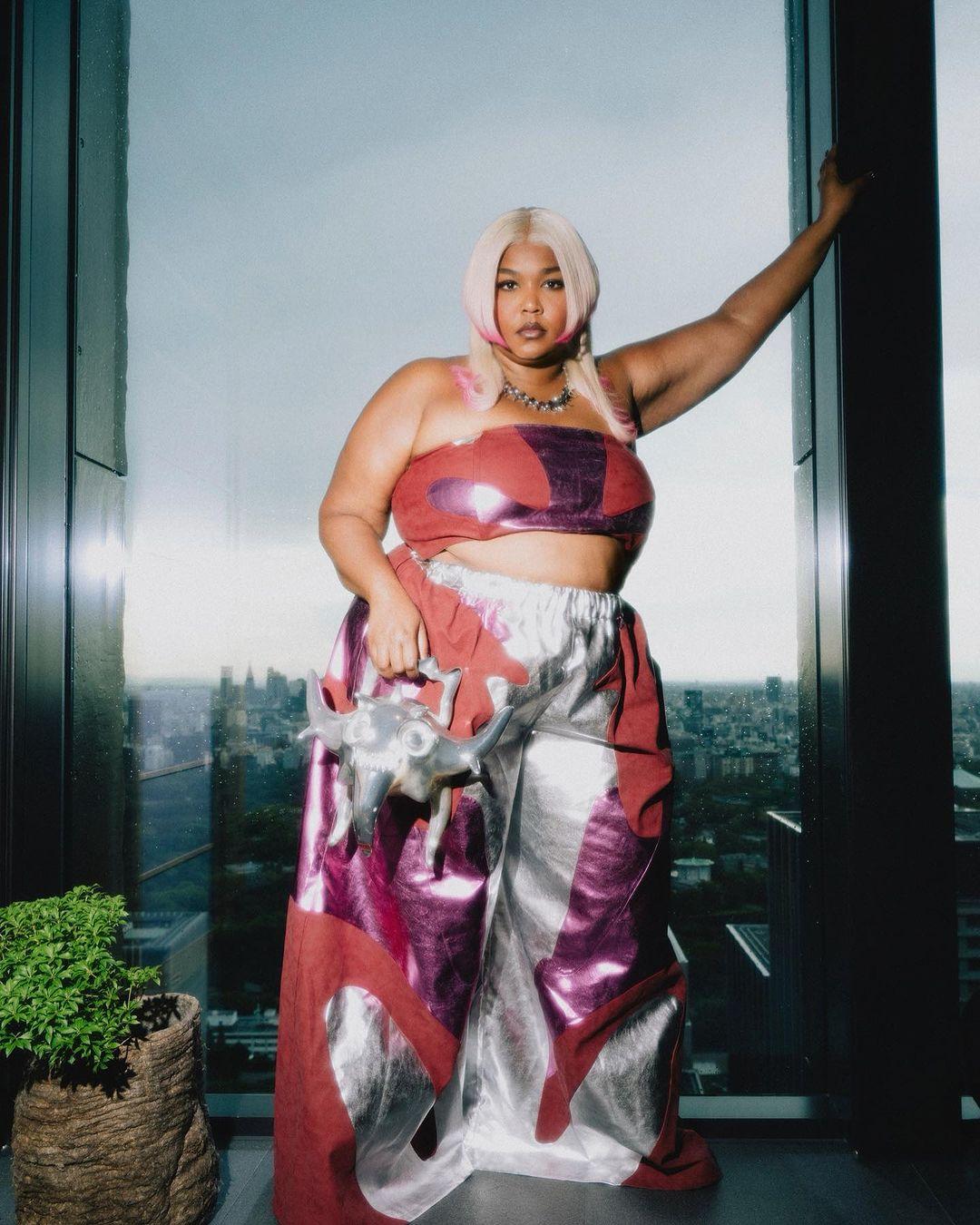 Lizzo reps her shapewear brand in Yitty outfit beneath glossy pink