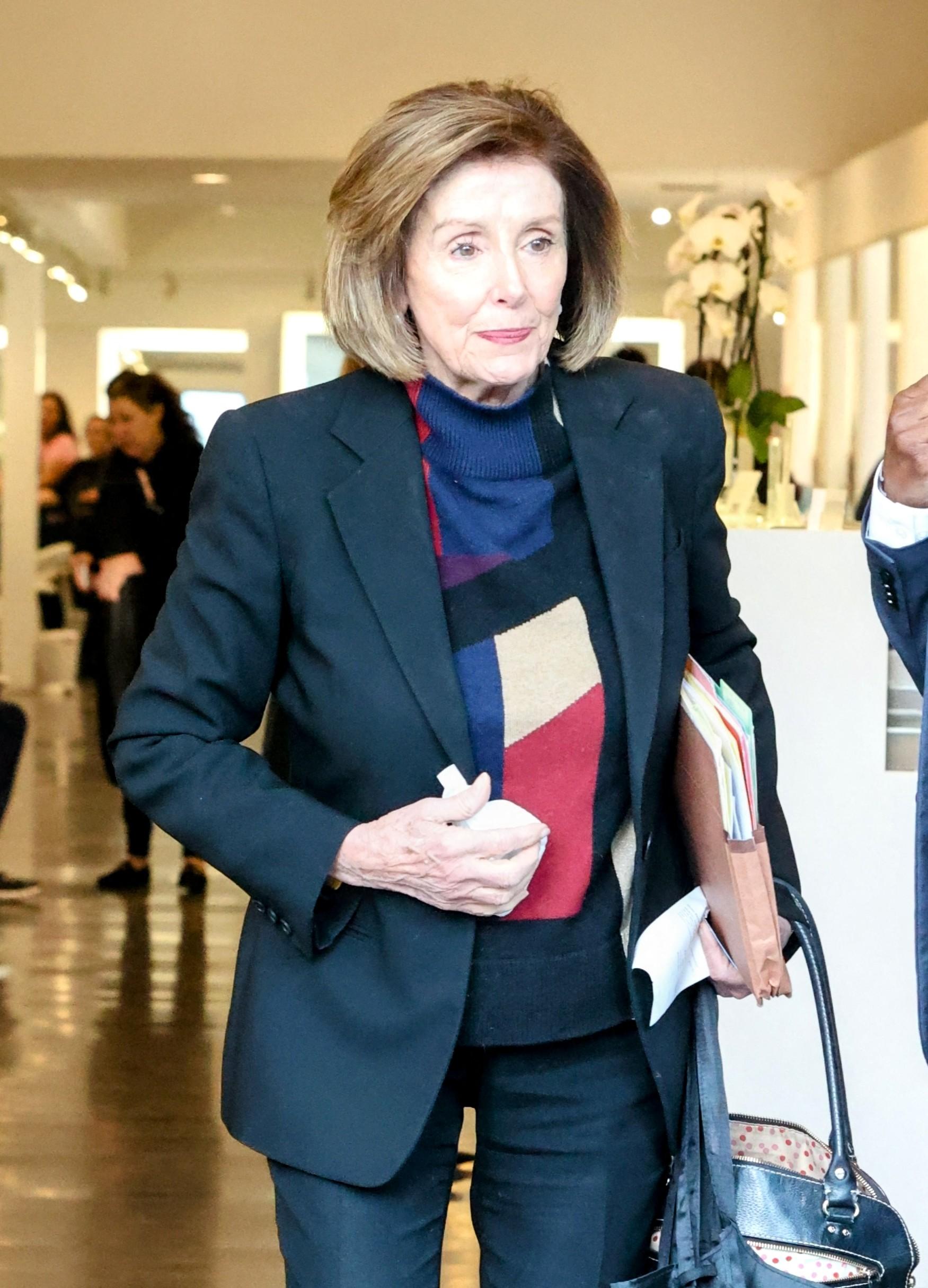 Nancy Pelosi leaving an establishment
