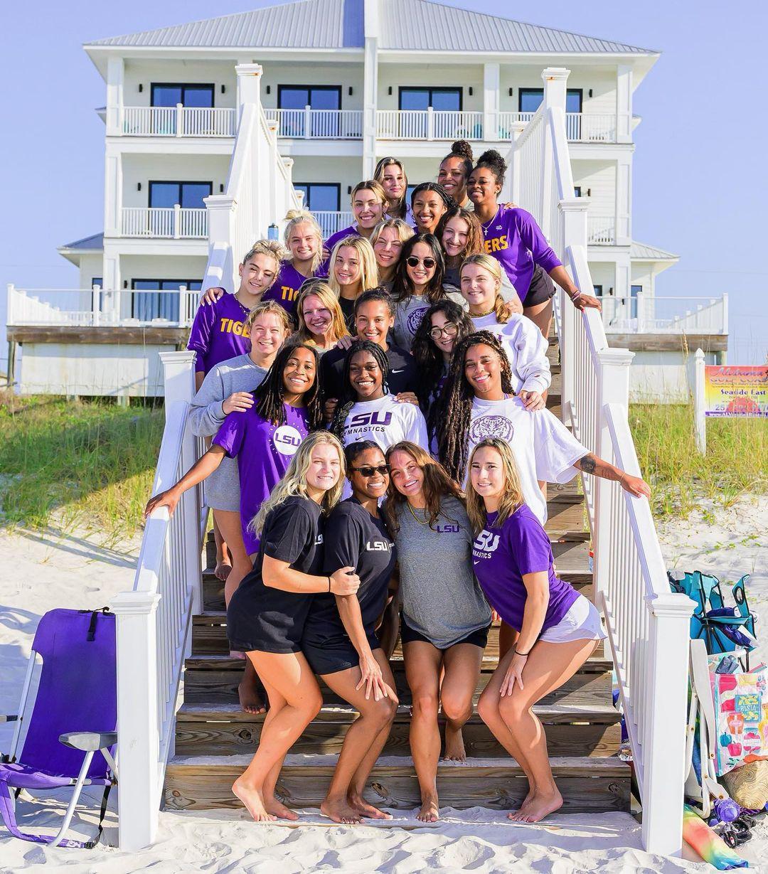 Olivia Dunne posing with her LSU Tigers teammates at the beach.