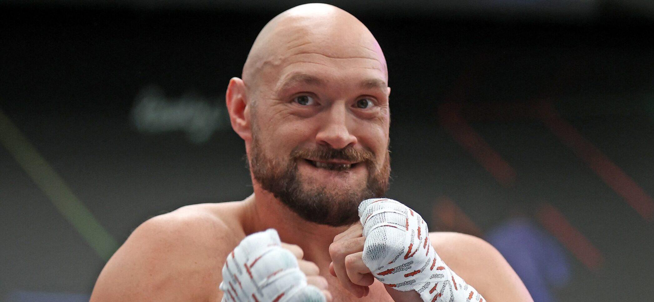 World Heavyweight Champion Tyson Fury holds an open workout training session at Boxpark Wembley with his trainer Suger Hill Steward