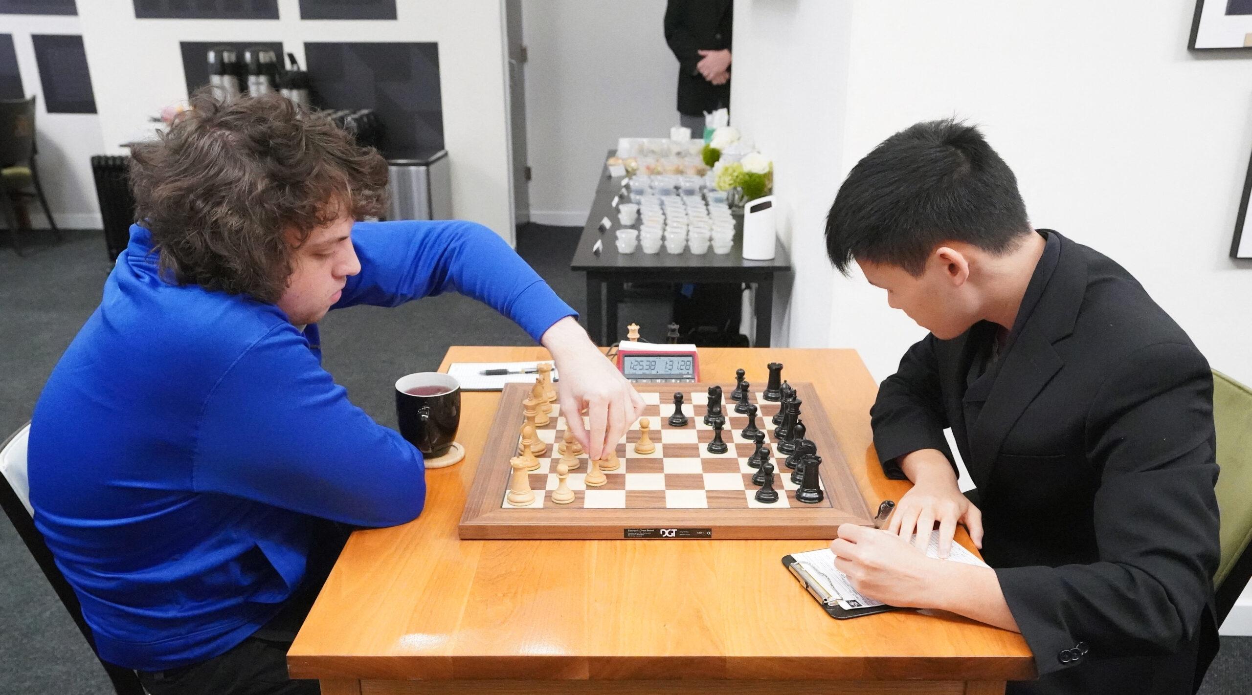 Chess Grandmaster Hans Niemann (L) makes a move while playing Chess Grandmaster Awonder Liang in Round 13 of the U.S. Championship 2022