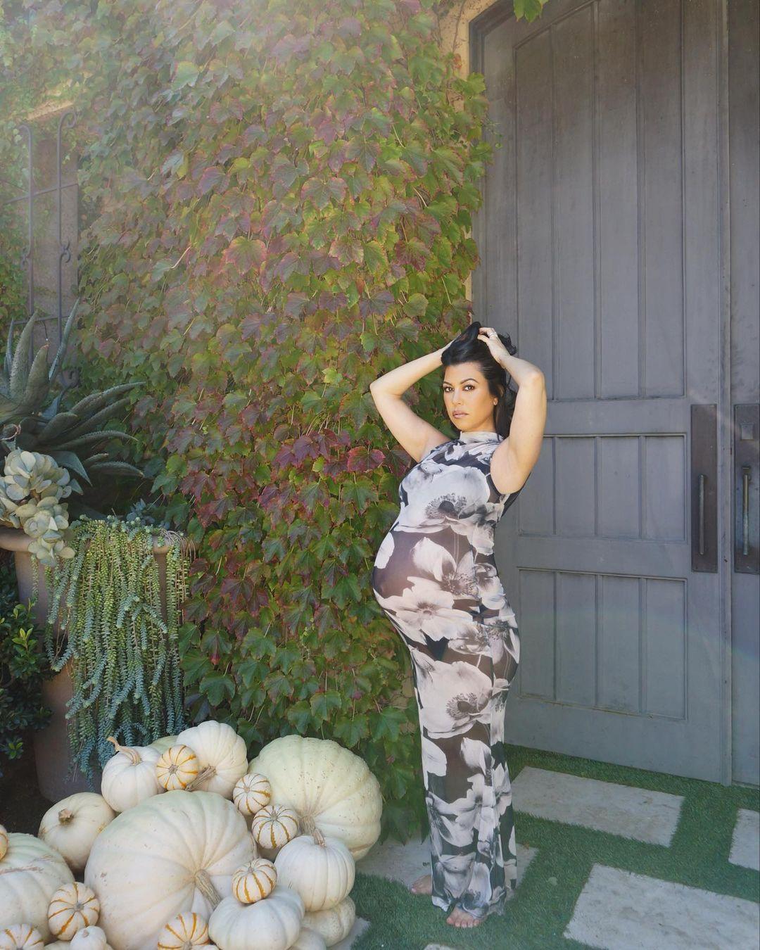 Kourtney Kardashian flaunts growing baby bump in dress from Boohoo collaboration