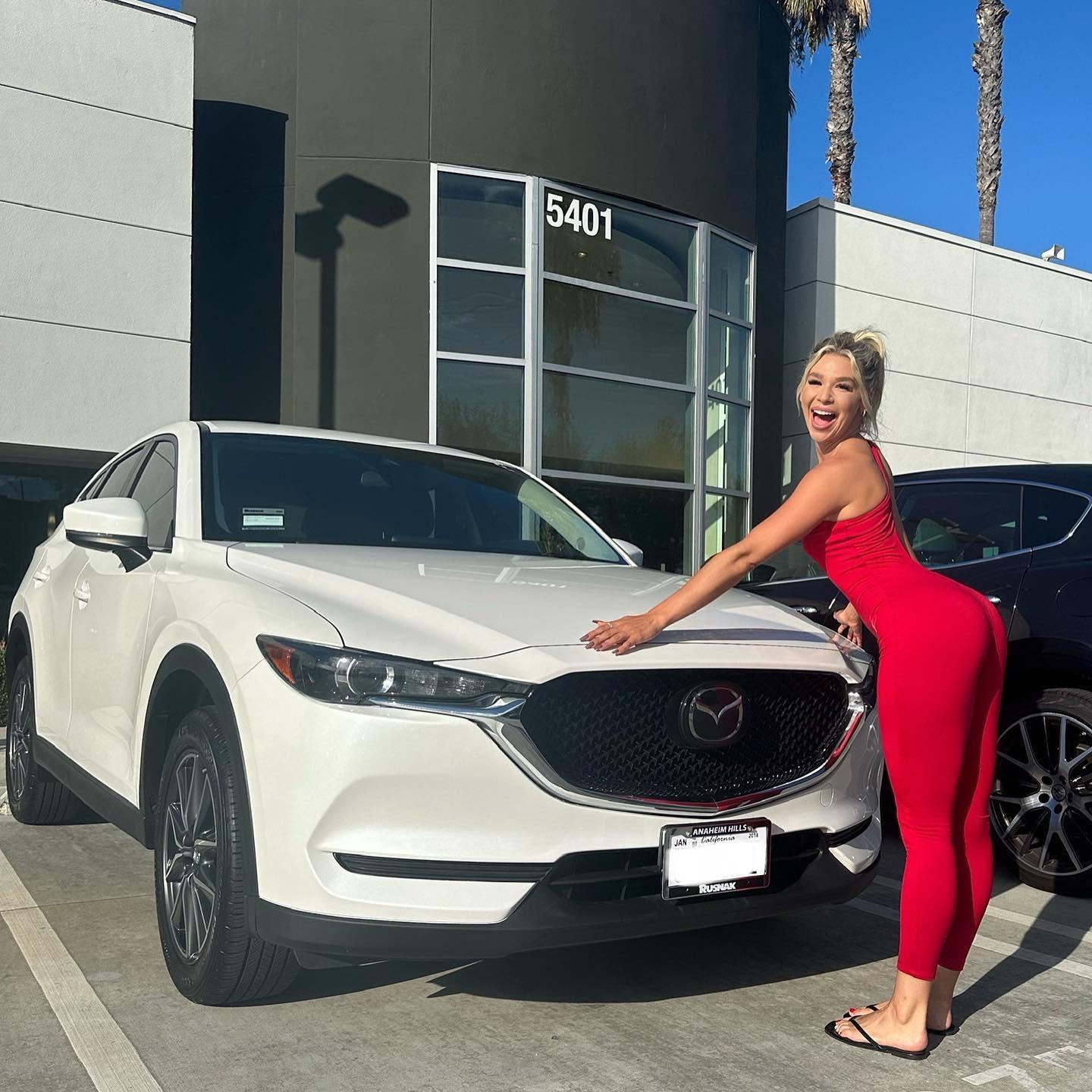 Lindsey Gordon In Curve-Hugging Bodysuit Poses With New Car 2