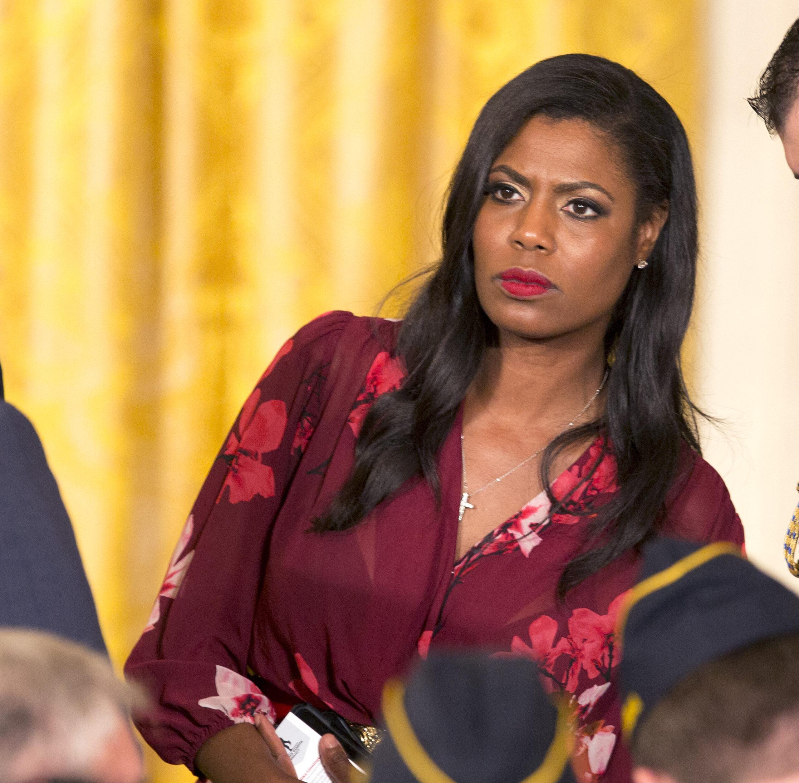 Omarosa in a floral top