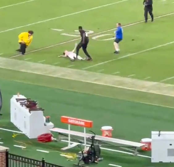 Fan Knocked Out COLD By NCAA Security, Dragged Off Field