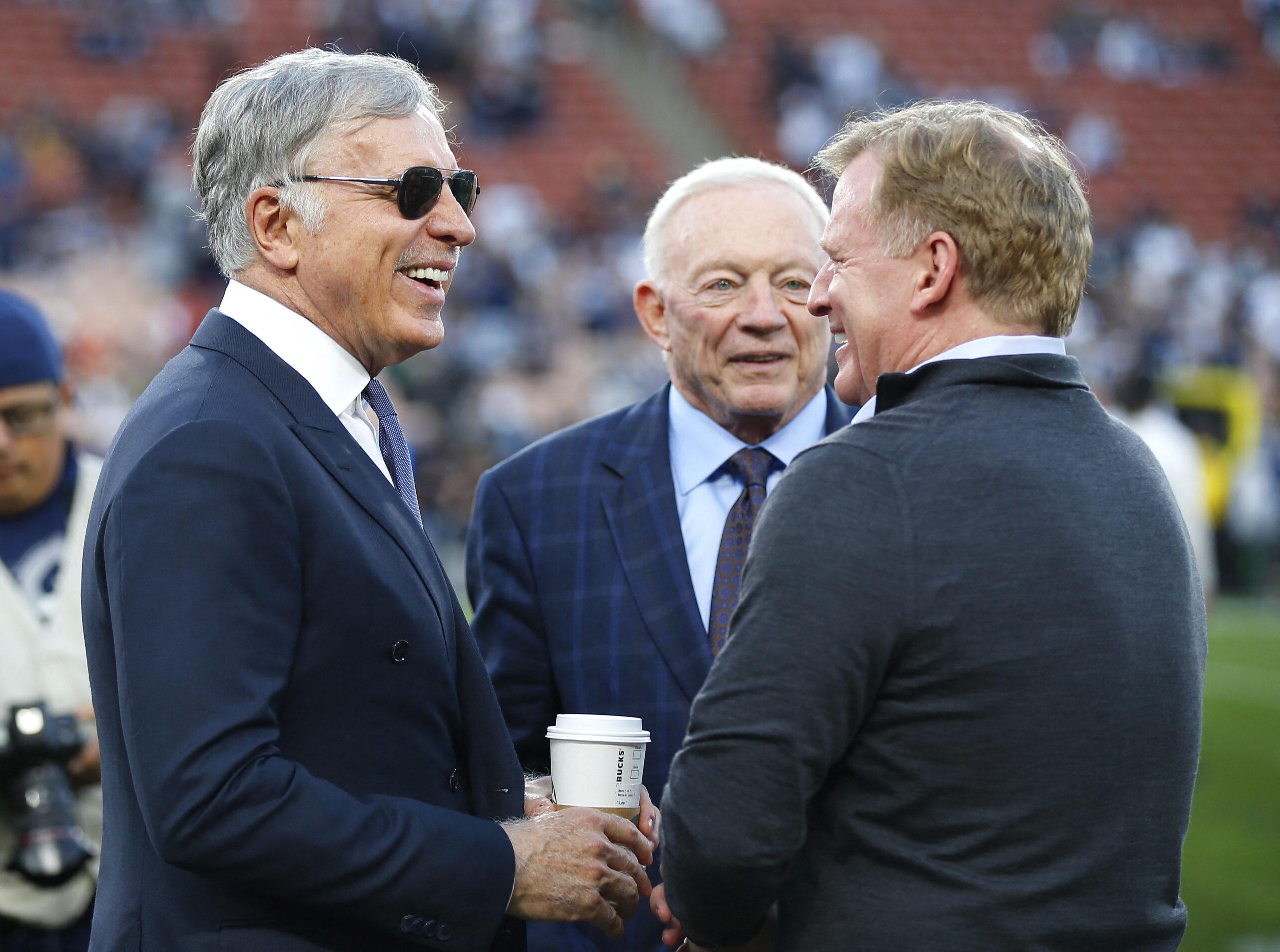 Los Angeles Rams owner Stan Kroenke, left, Dallas Cowboys owner Jerry Jones, and NFL Commissioner Roger Goodell talk before a NFC Divisional playoff game at the Los Angeles Memorial Coliseum. The Rams won 30-22.