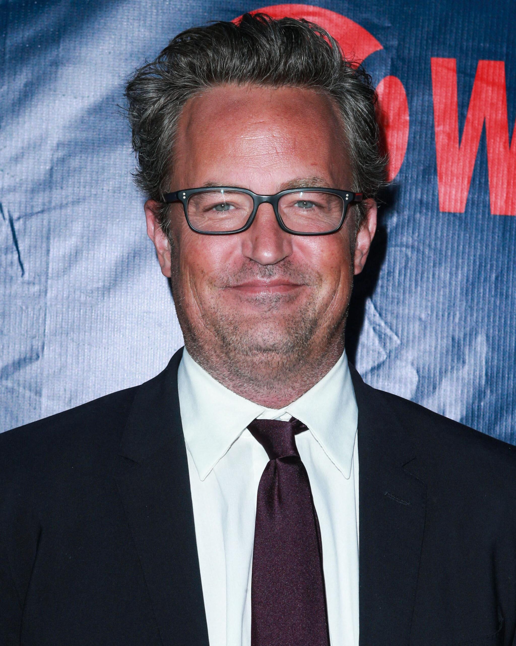 Matthew Perry smiling for red carpet event