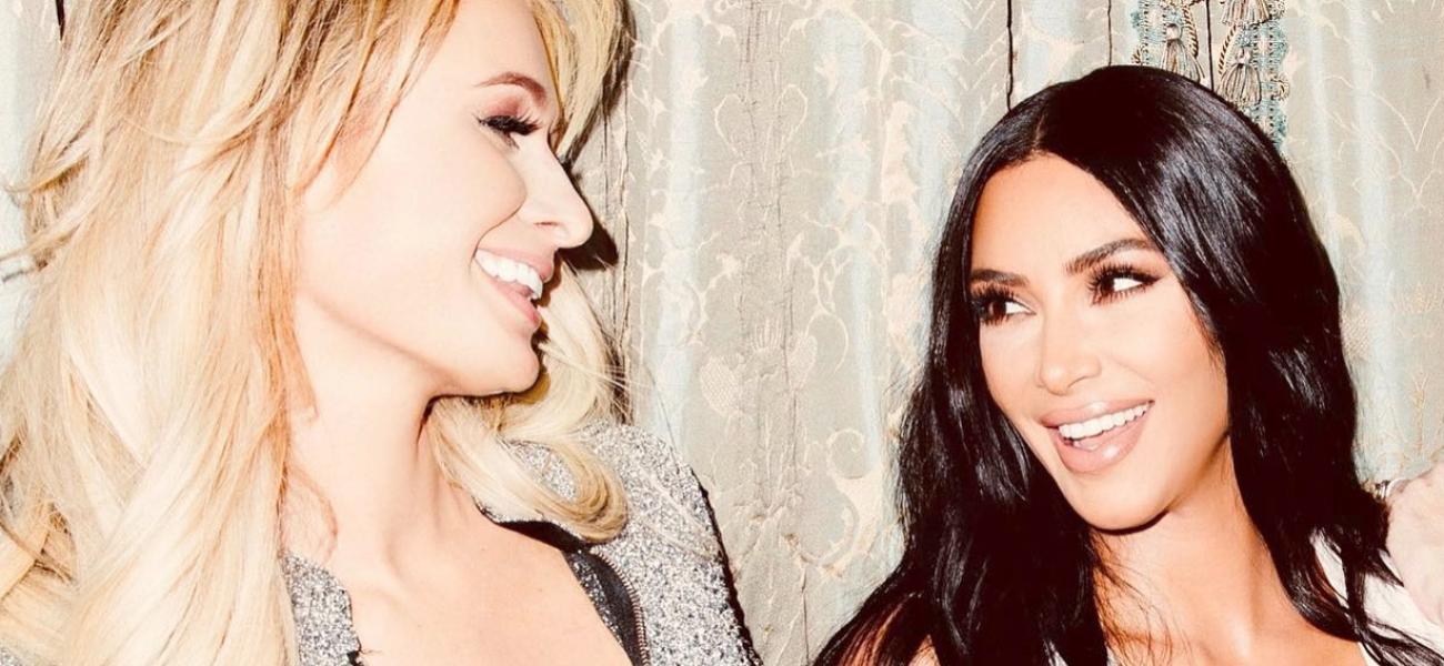Paris Hilton and Kim Kardashian smiling