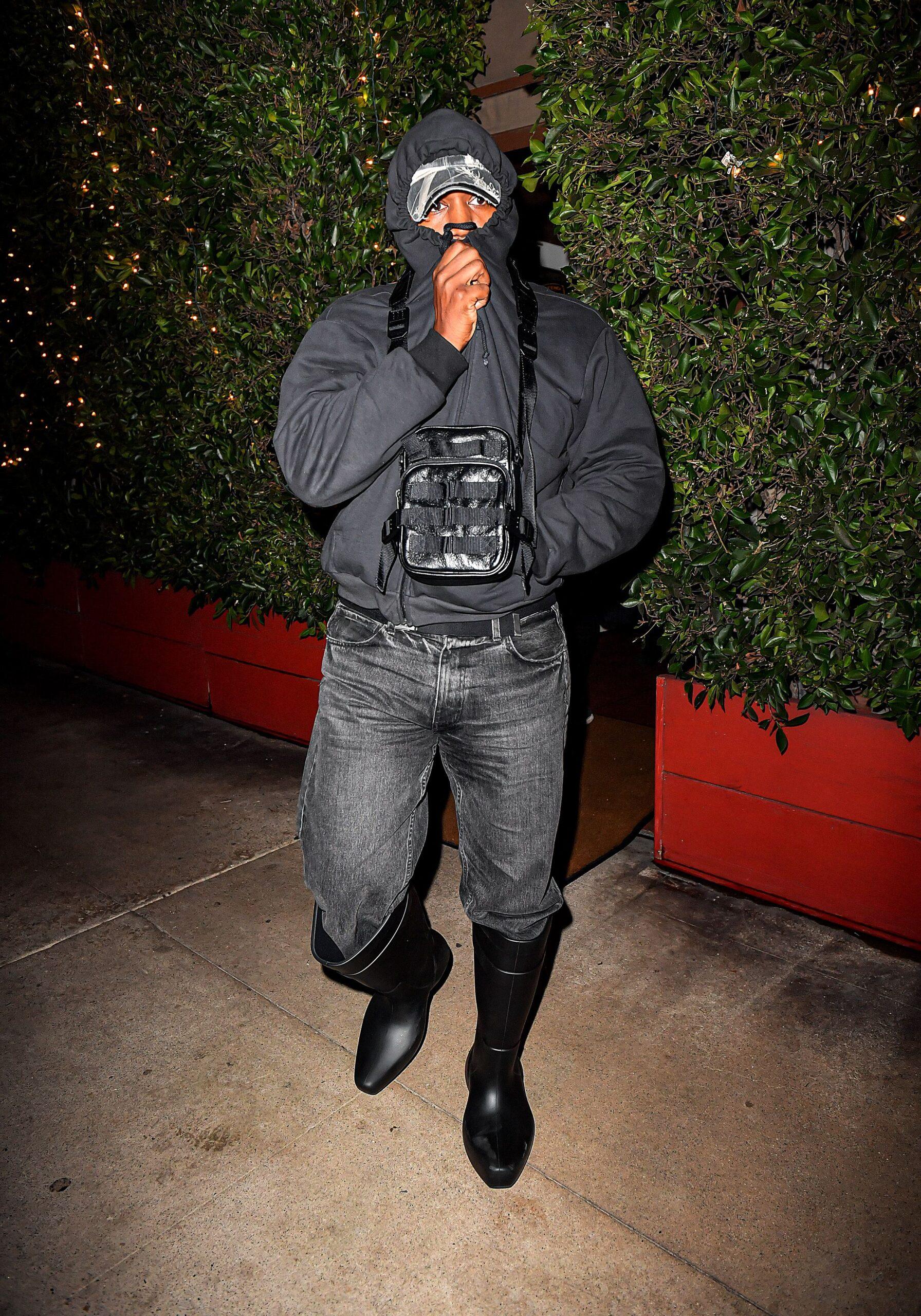Kanye West in black jacket and black jeans