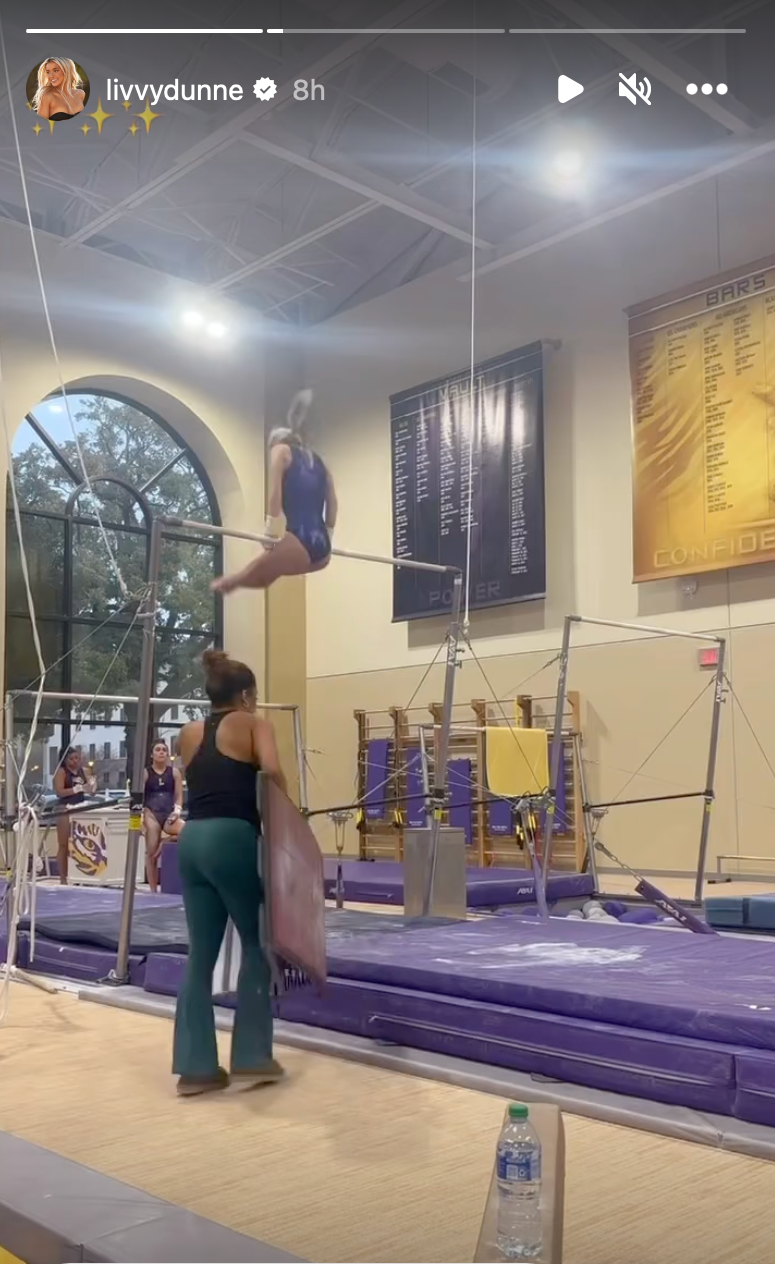 Olivia Dunne trains on the uneven bars.