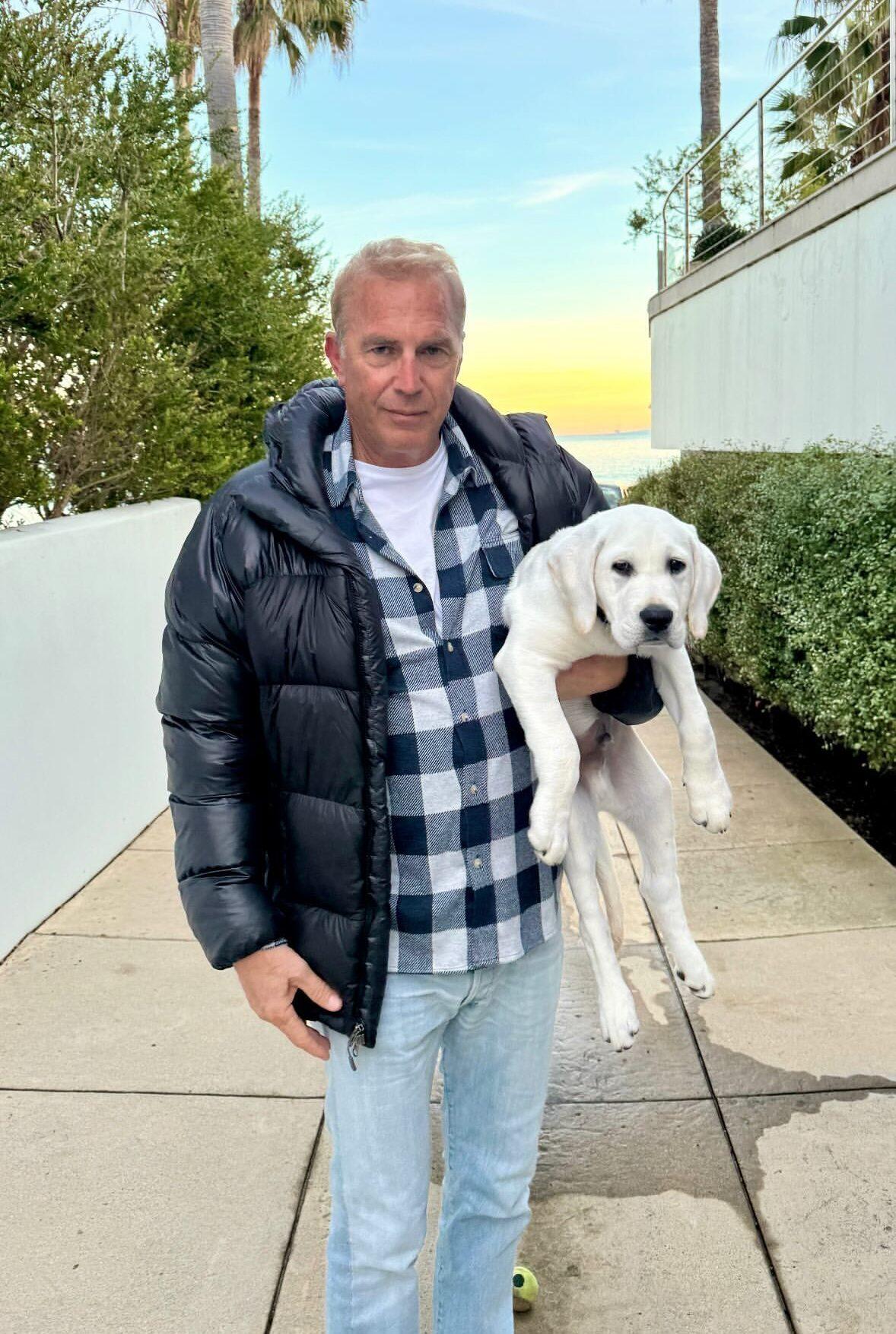 Kevin Costner Poses With His New Puppy