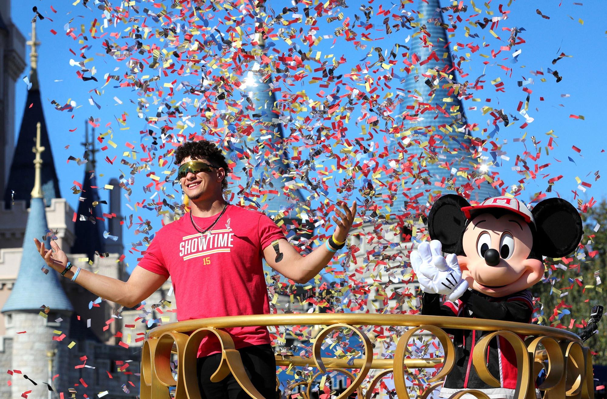 Mickey Mouse with Super Bowl MVP and Kansas City Chiefs quarterback Patrick Mahomes during a parade at the Magic Kingdom in 2020.