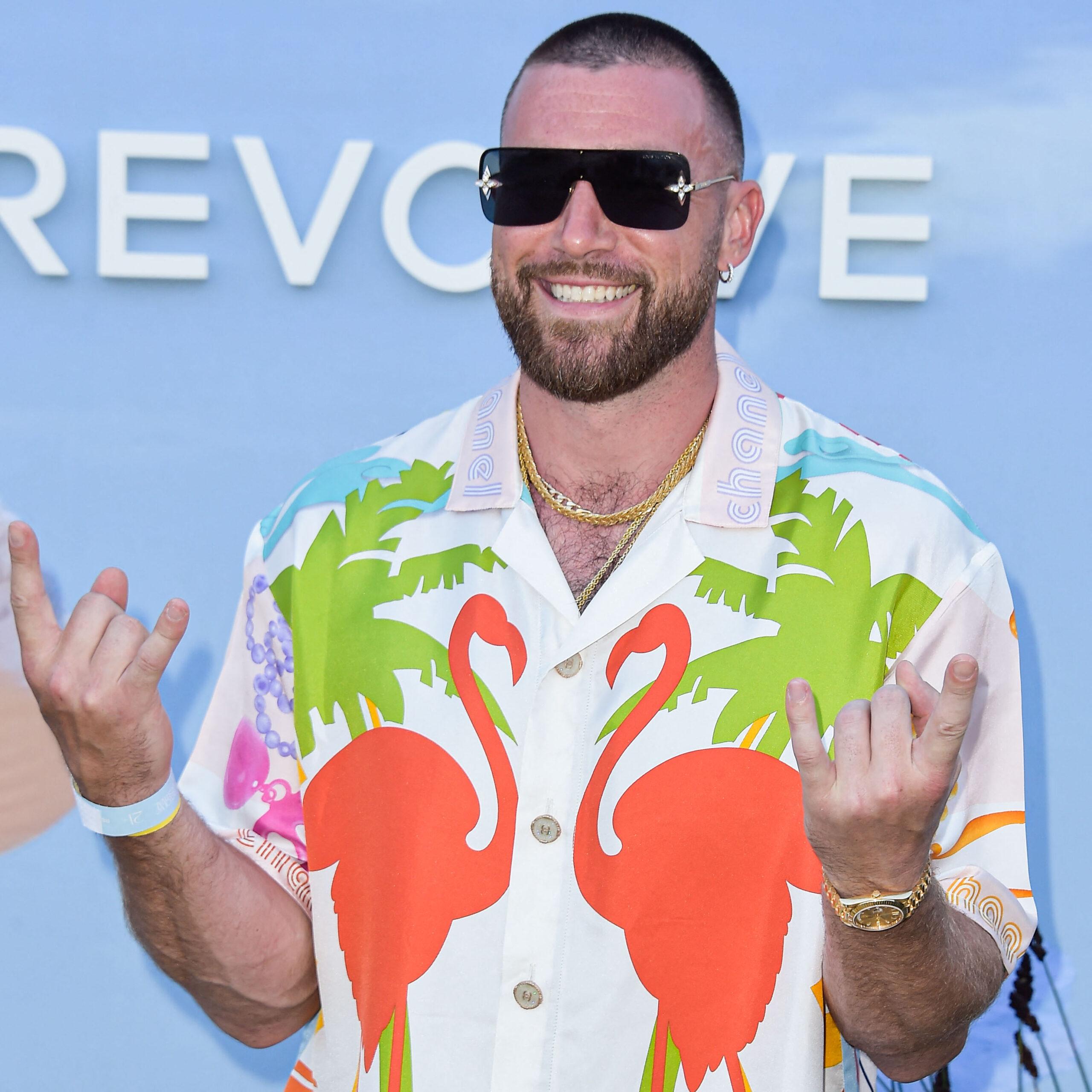 Travis Kelce smiling at Revolve event in sunglasses