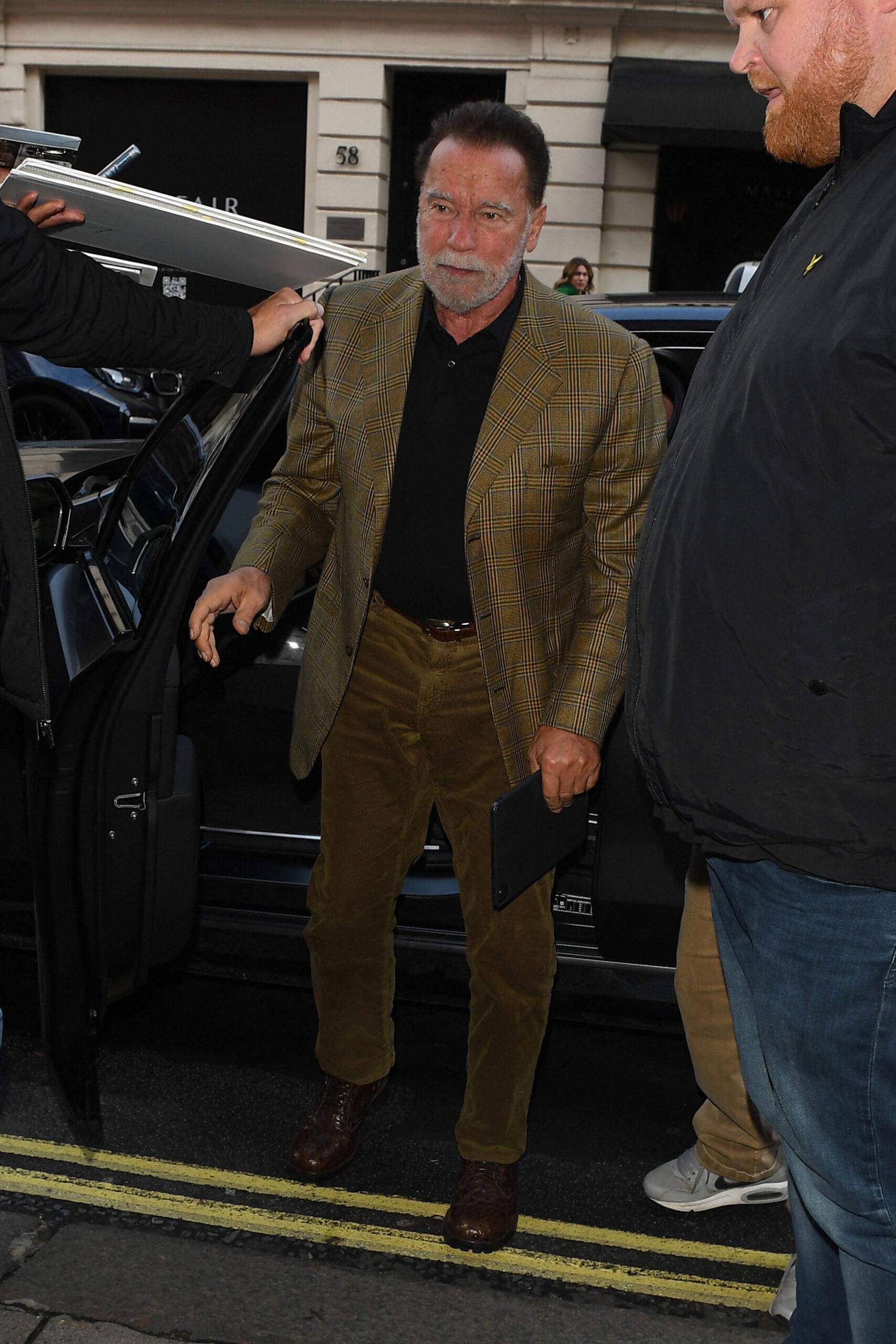 Arnold Schwarzenegger saw arriving in his hotel in Central London