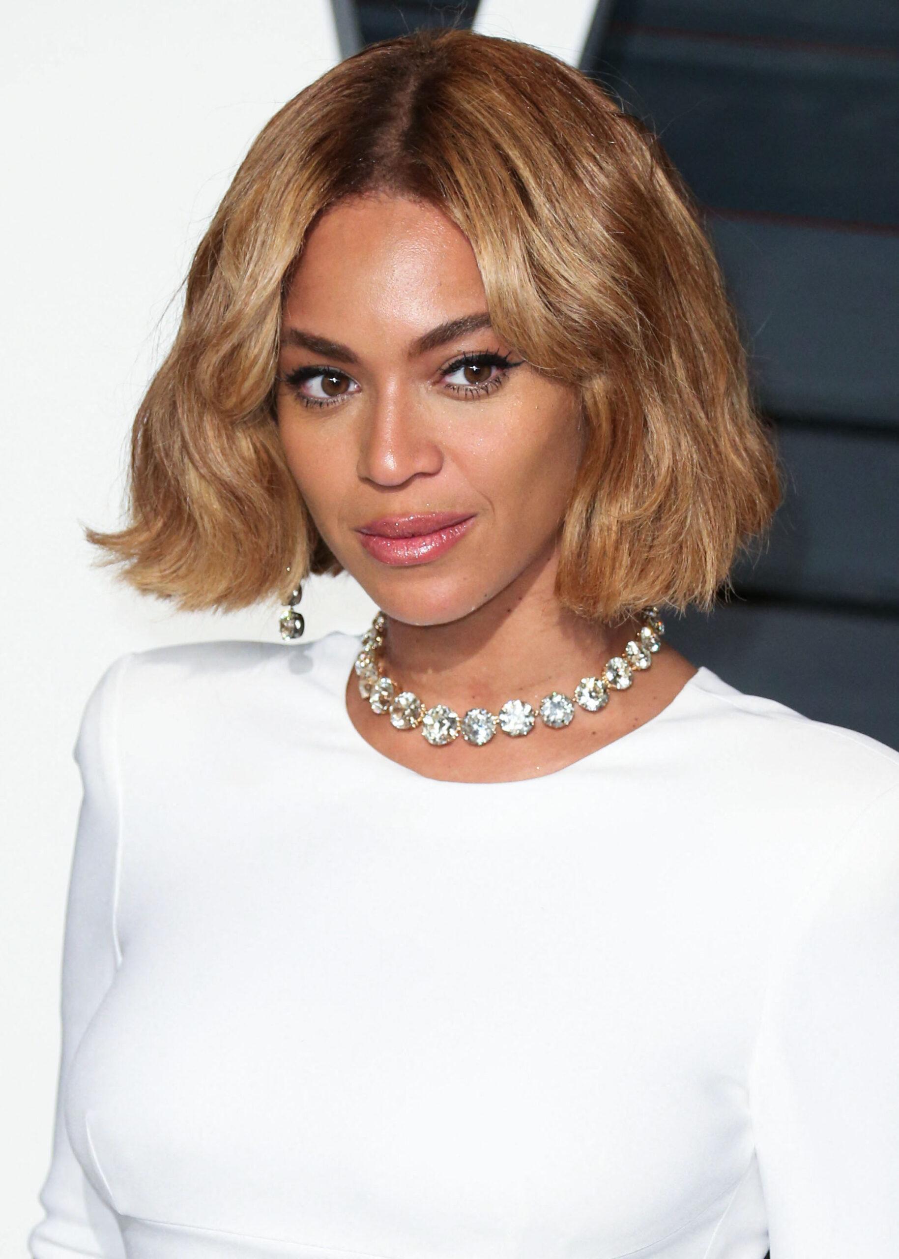 Beyonce in white long-sleeve dress