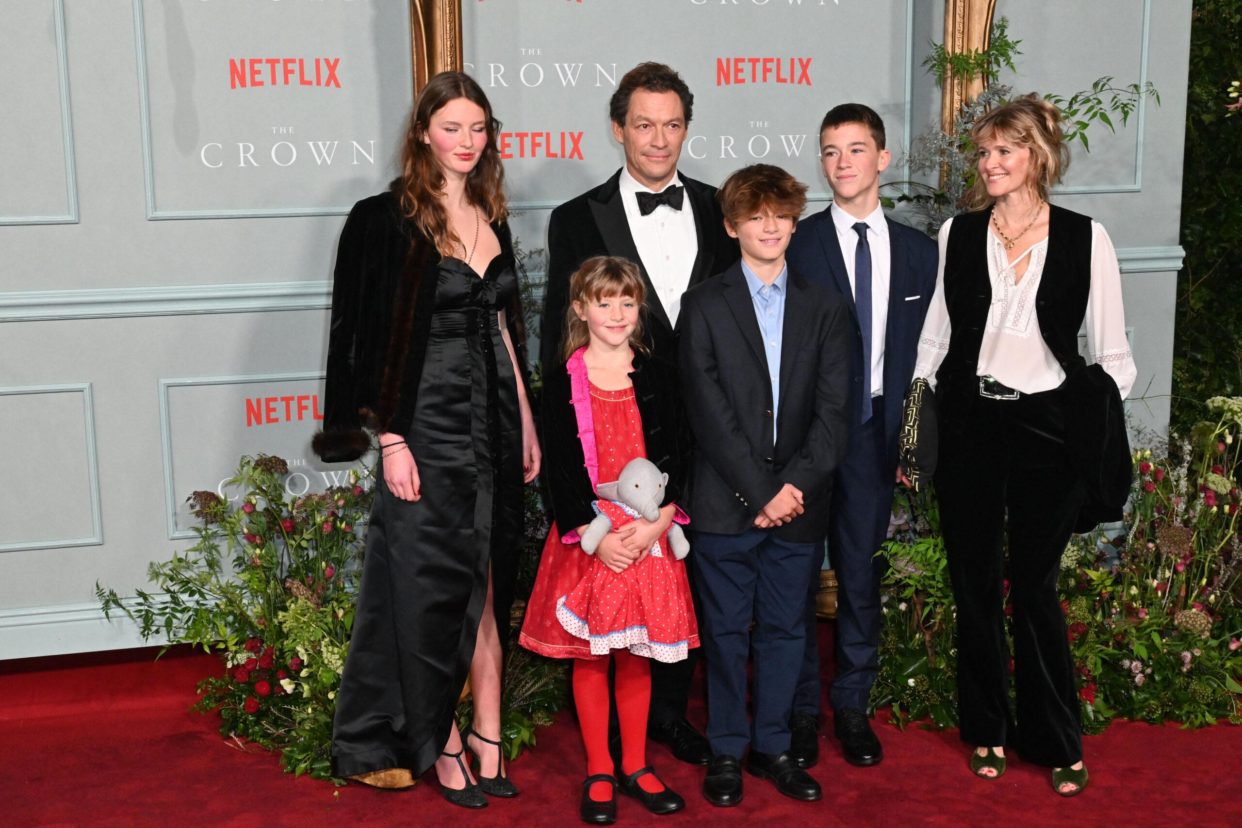 A family poses at a movie premiere.