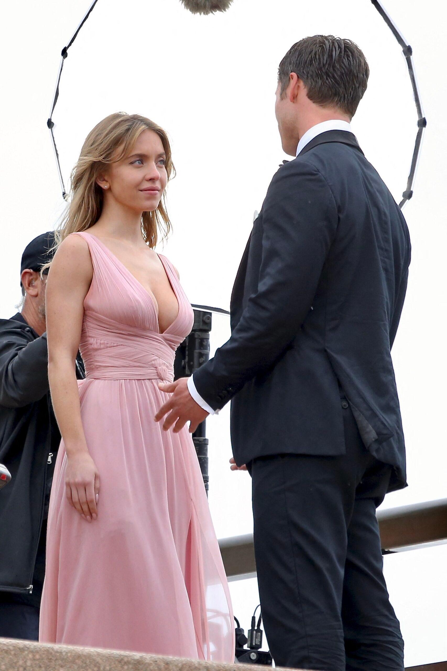 Sydney Sweeney and Glen Powell film what appears to be a wedding scene for their new rom-com