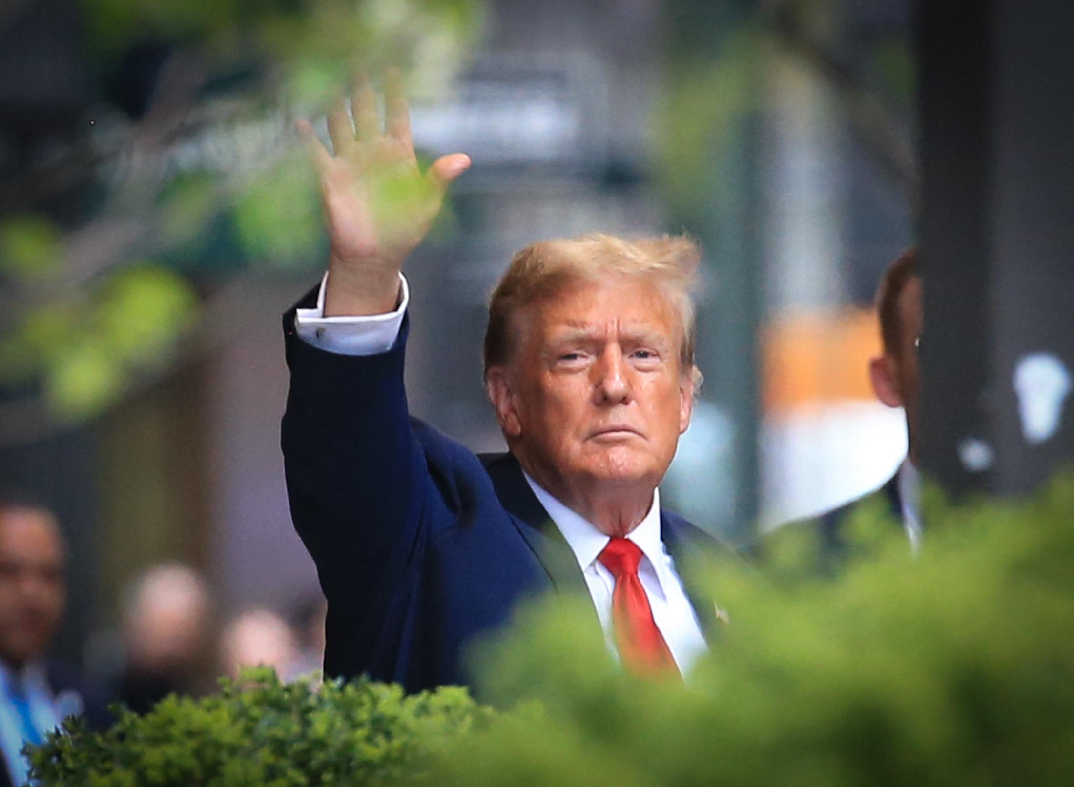 Donald Trump leaves Trump Tower to head to court for Stormy Daniels hush money case.