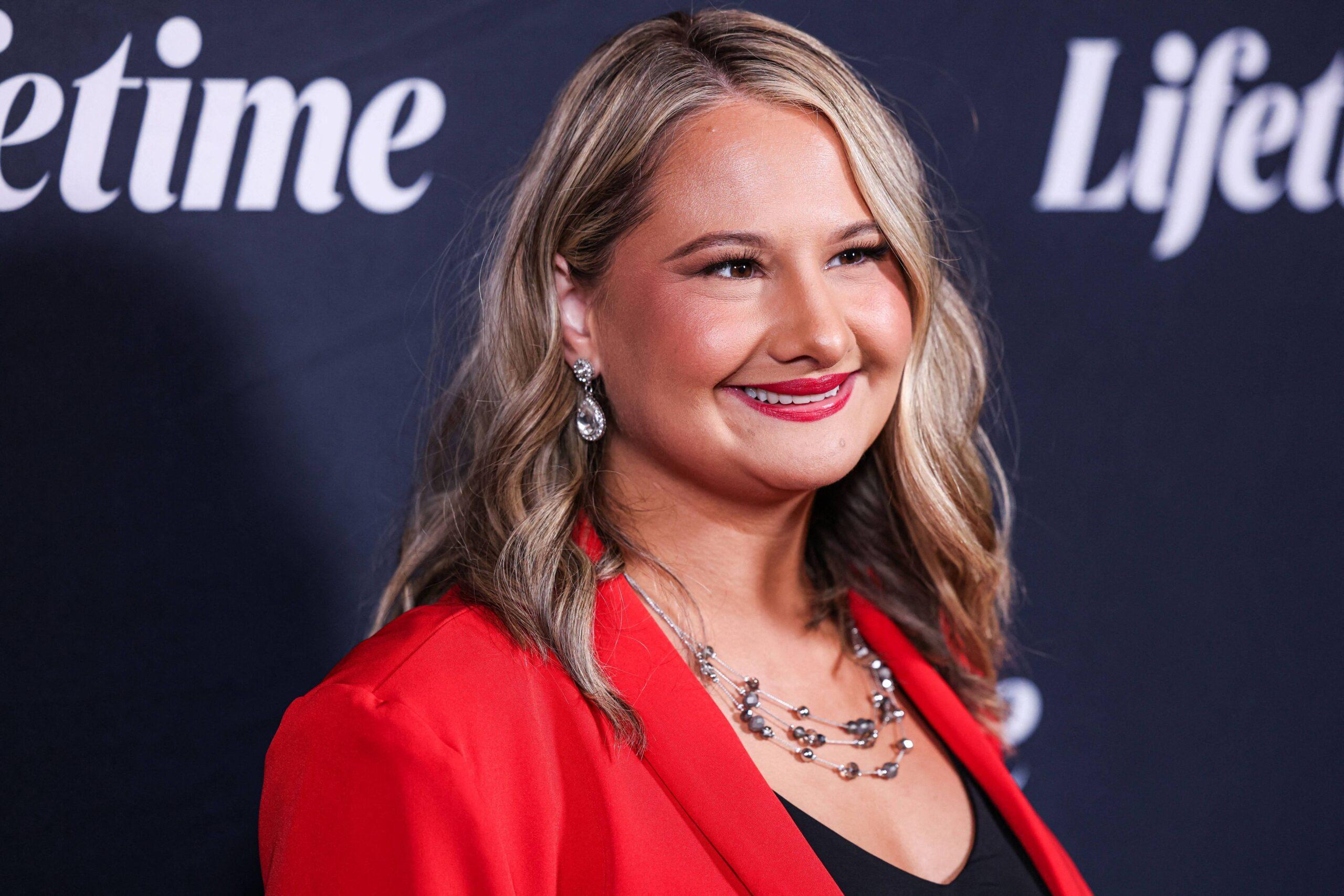 <img src="gypsy-rose-blanchard-red-blazer.jpg" alt="Gypsy Rose Blanchard wearing a red blazer at Lifetime event">