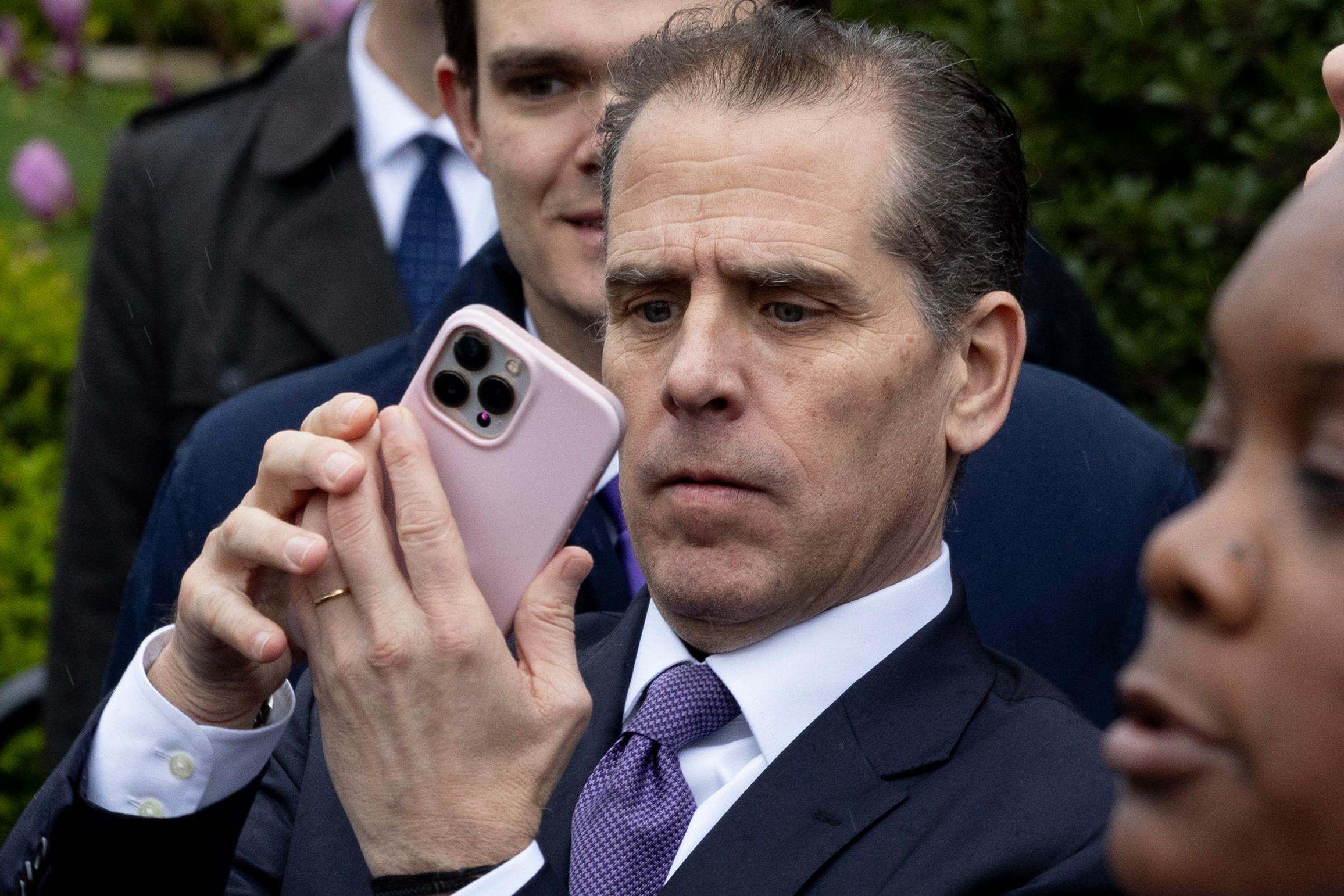Hunter Biden holding a cell phone