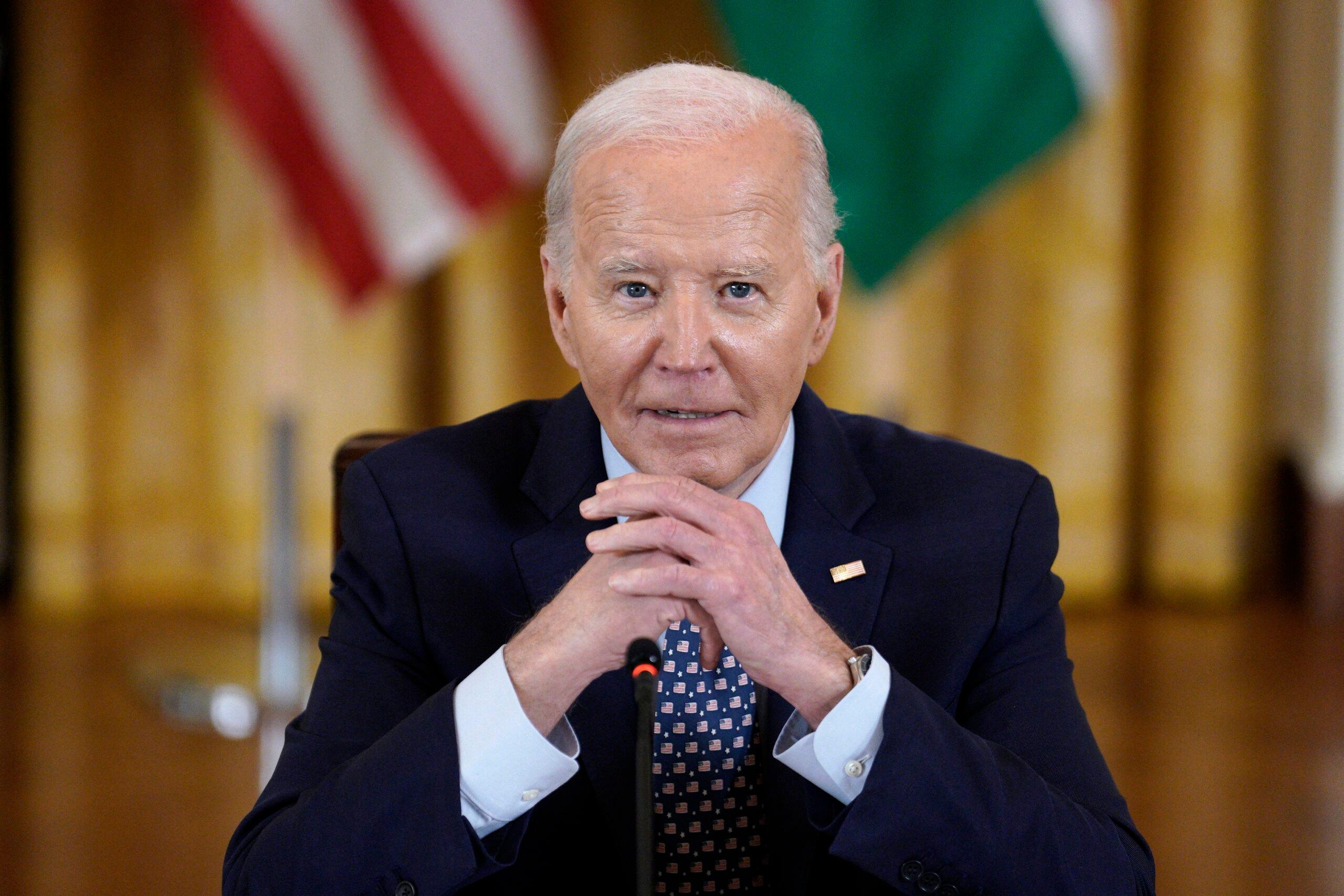 Joe Biden sitting at his desk