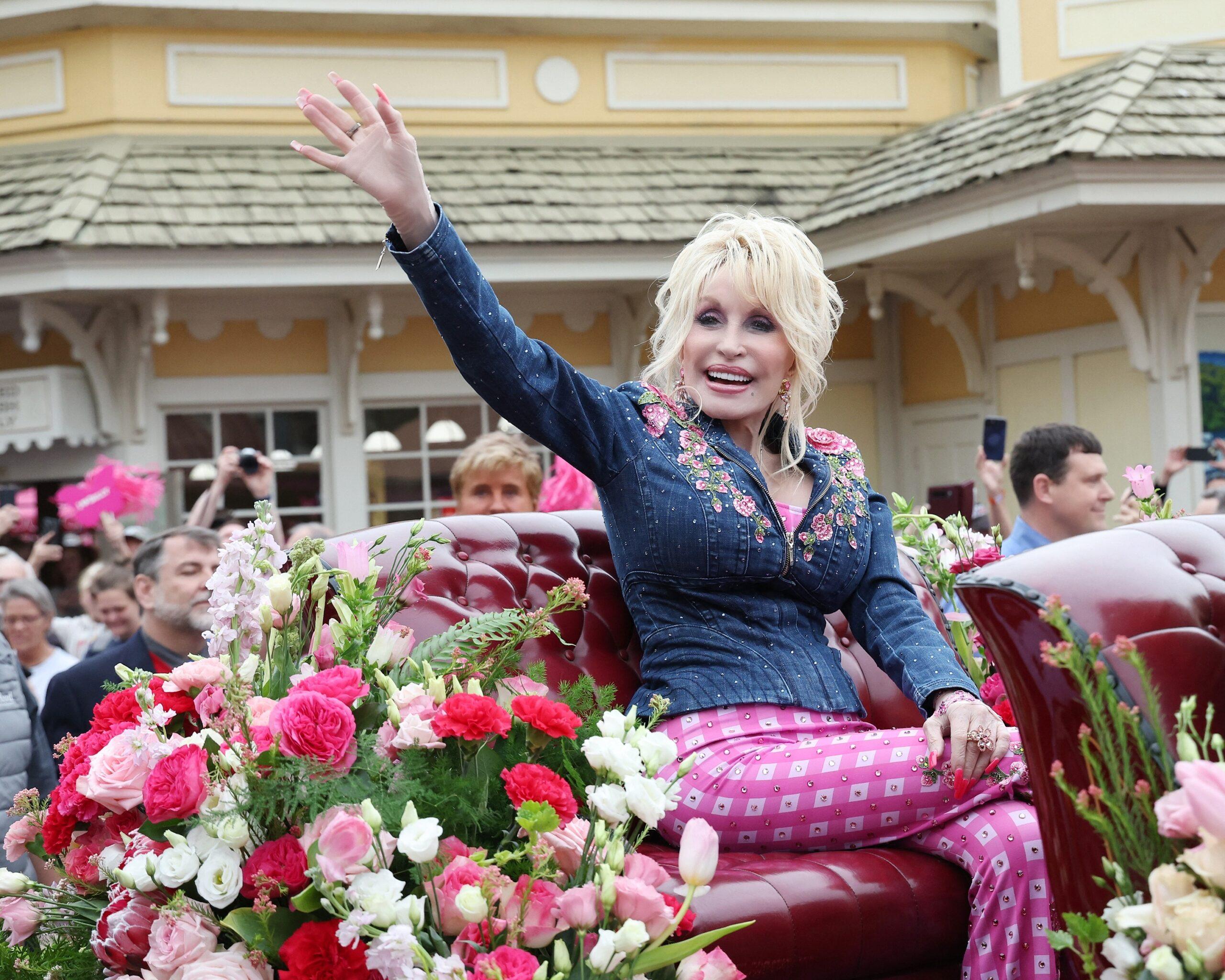 Dolly Parton waves to fans