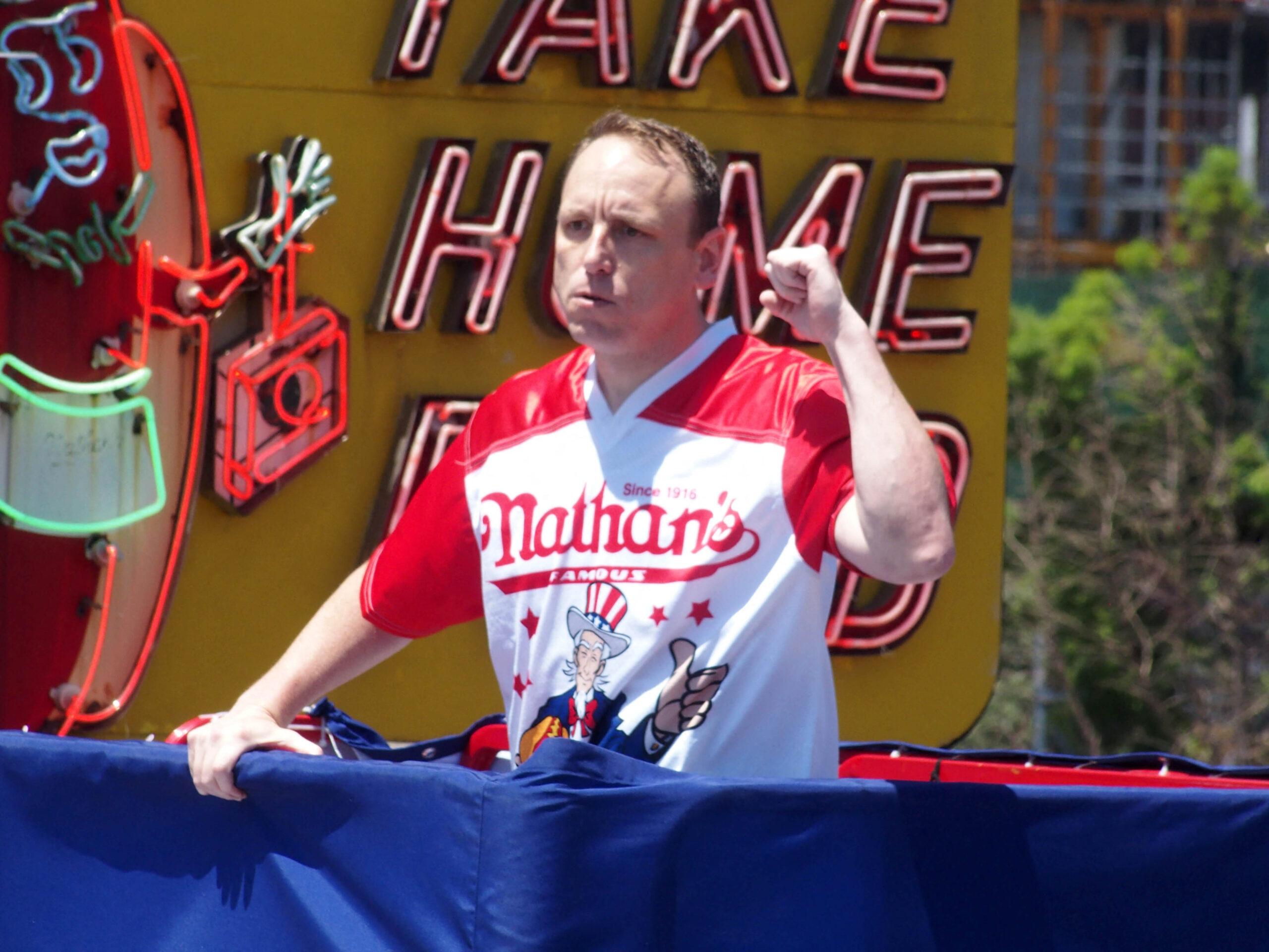 Joey Chestnut shoves hot dogs in his mouth