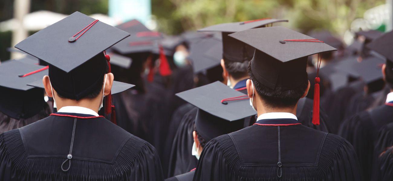 Students wearing graduation caps and gowns