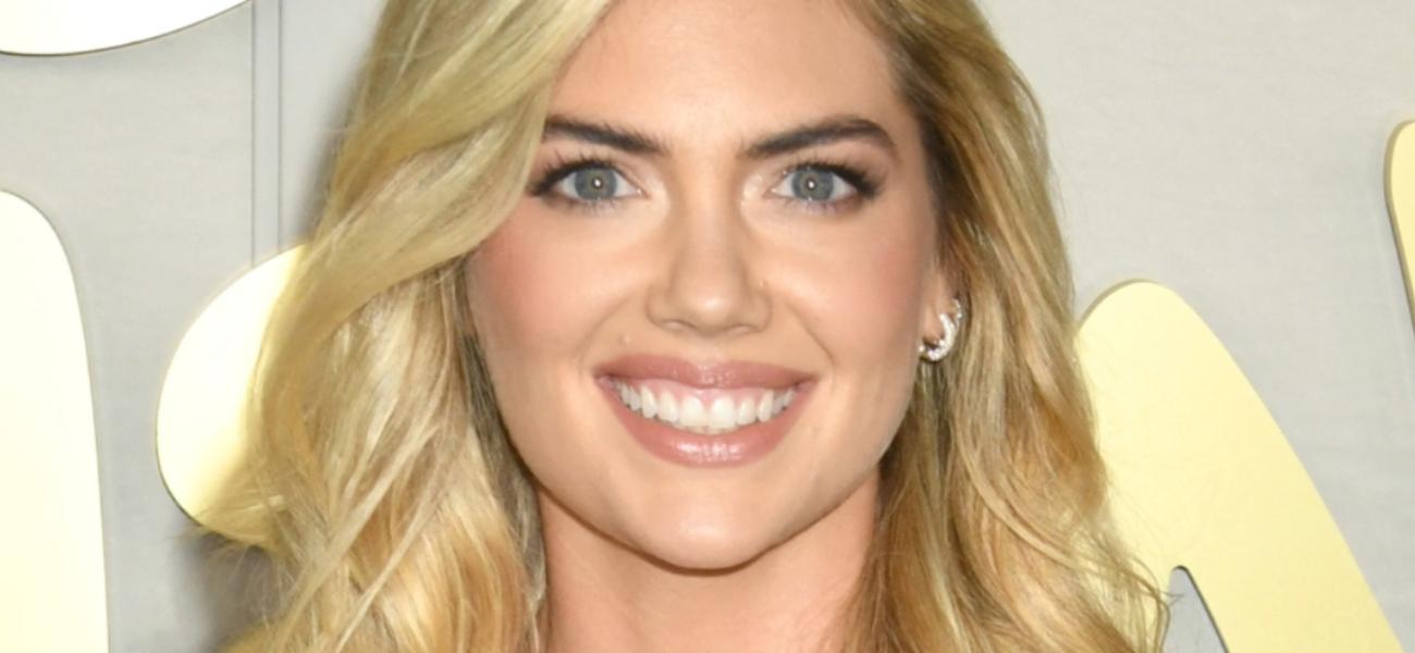 Kate Upton smiles at an event