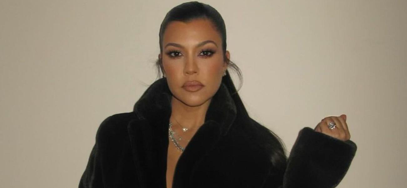 Kourtney Kardashian photographed wearing a black robe after the birth of son Rocky.