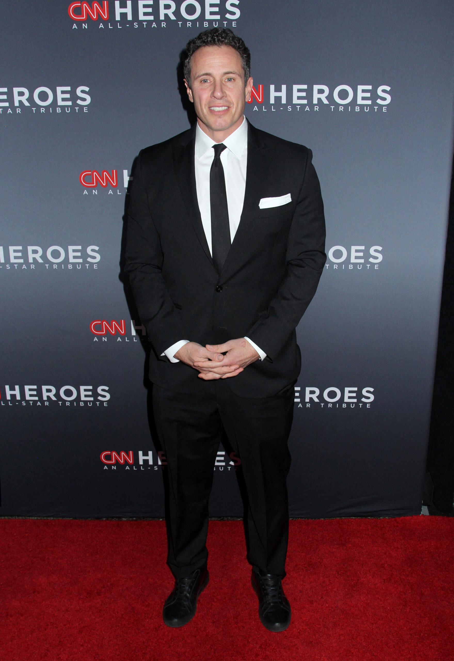 Chris Cuomo smiles in a black tuxedo